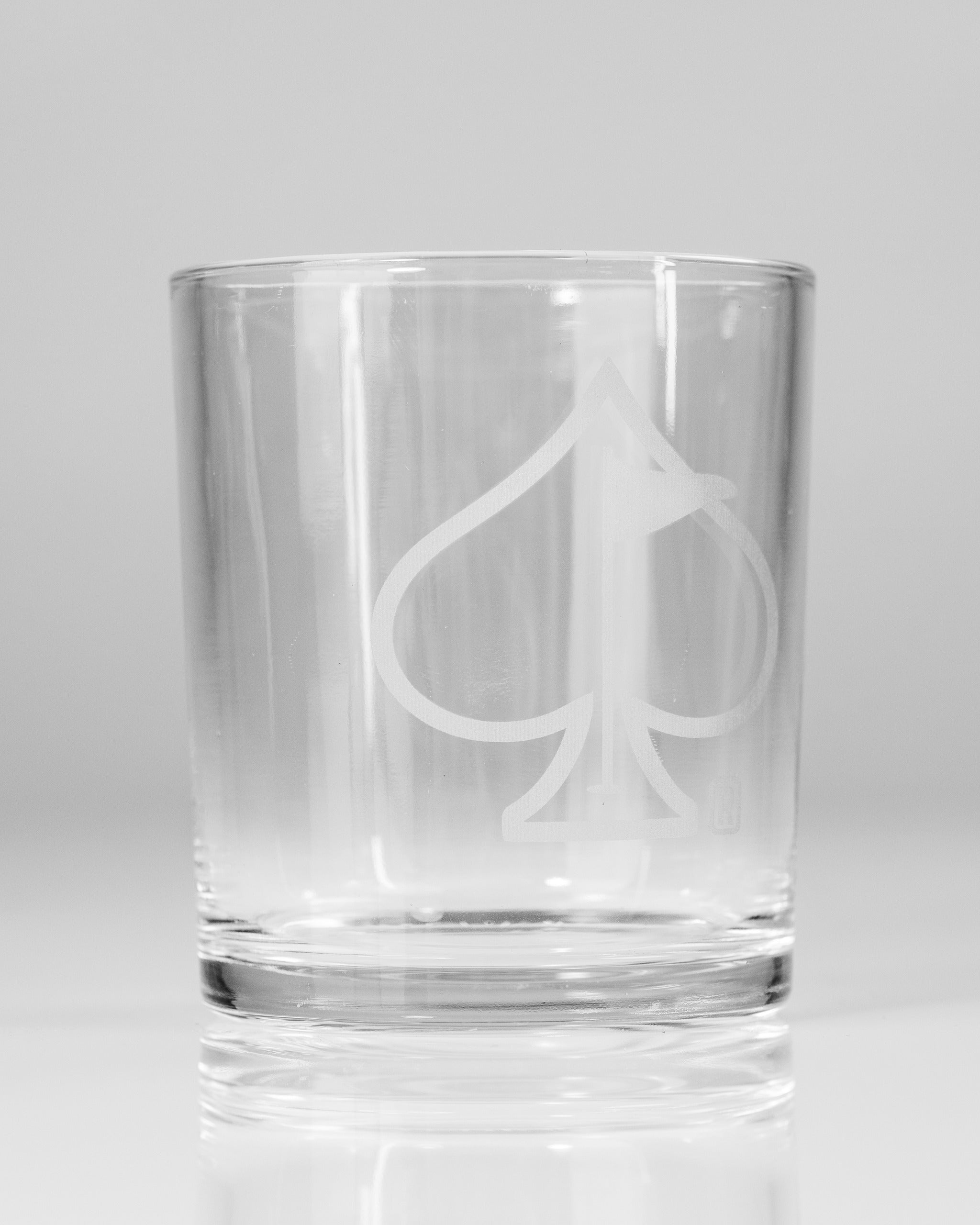 Set of 2 whisky glasses featuring a sleek design with an engraved spade logo, perfect for enjoying your favorite spirits.