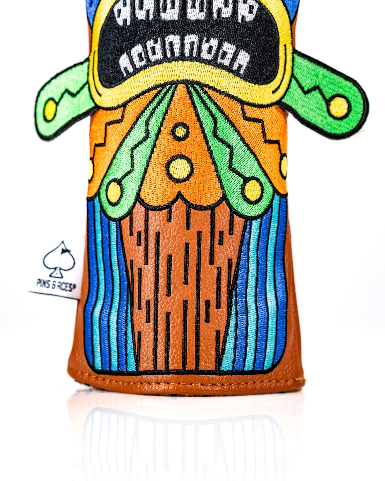 Colorful Tiki fairway cover featuring vibrant designs and a unique pattern, perfect for adding flair to your golf game.