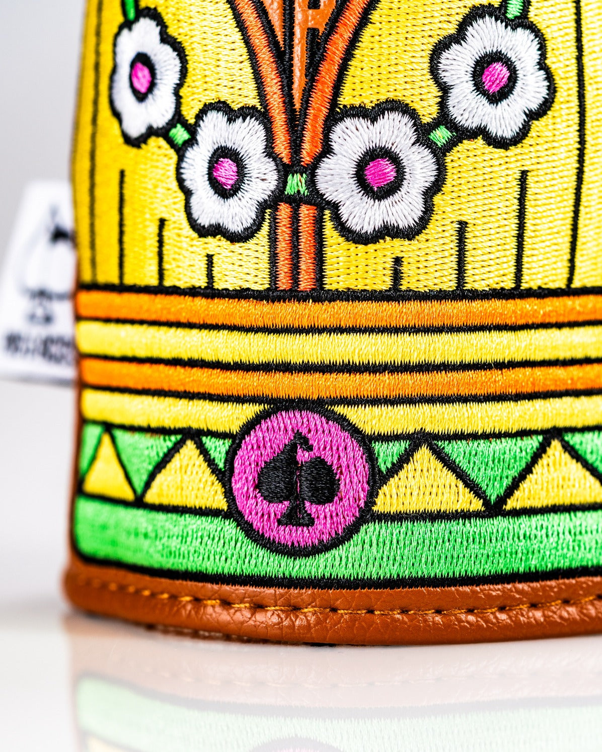 Colorful Tiki hybrid golf cover featuring vibrant embroidery and a playful design, perfect for stylish golfers.