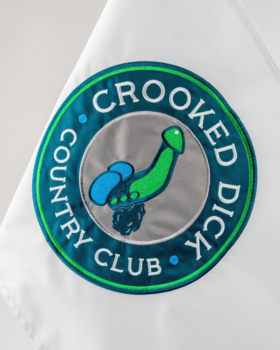 Bold golf flag featuring the playful "Crooked Dick Country Club" logo, perfect for adding humor to your game.