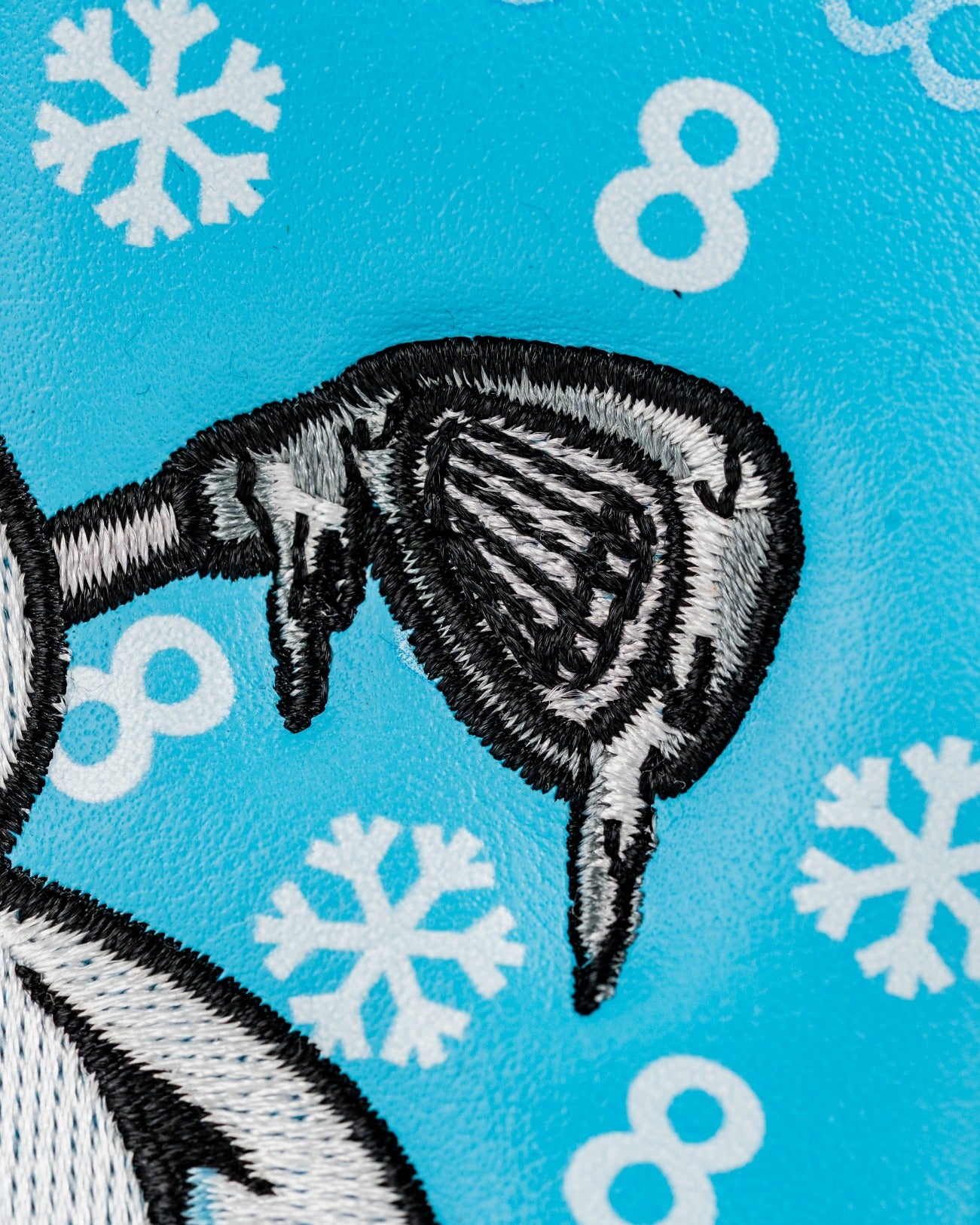Snowman mallet cover featuring a playful snowman design with snowflakes and a vibrant blue background.