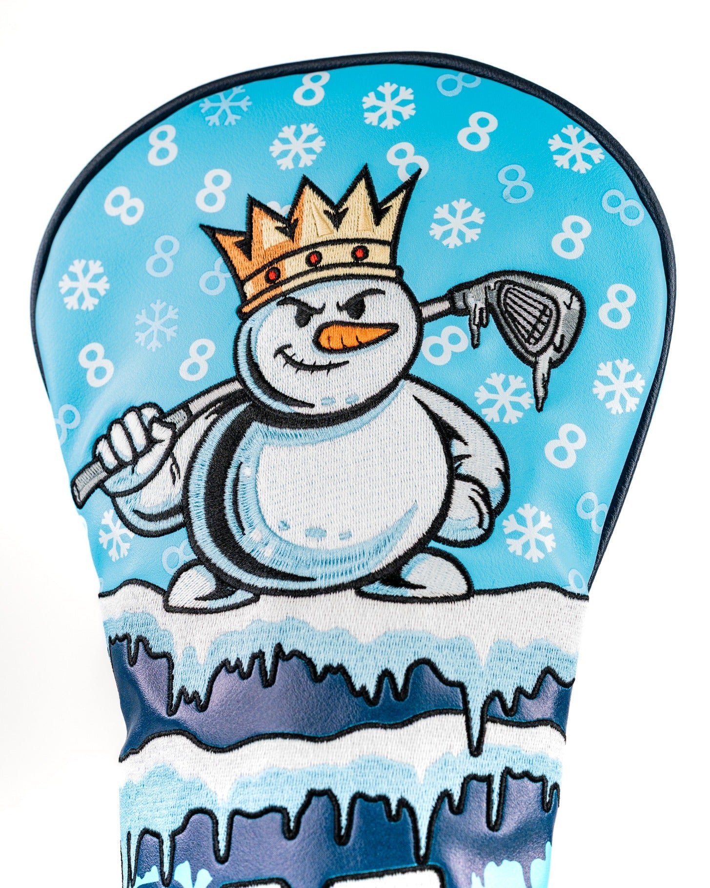 Snowman driver cover featuring a cartoon snowman with a crown, holding a golf club against a snowy blue background.