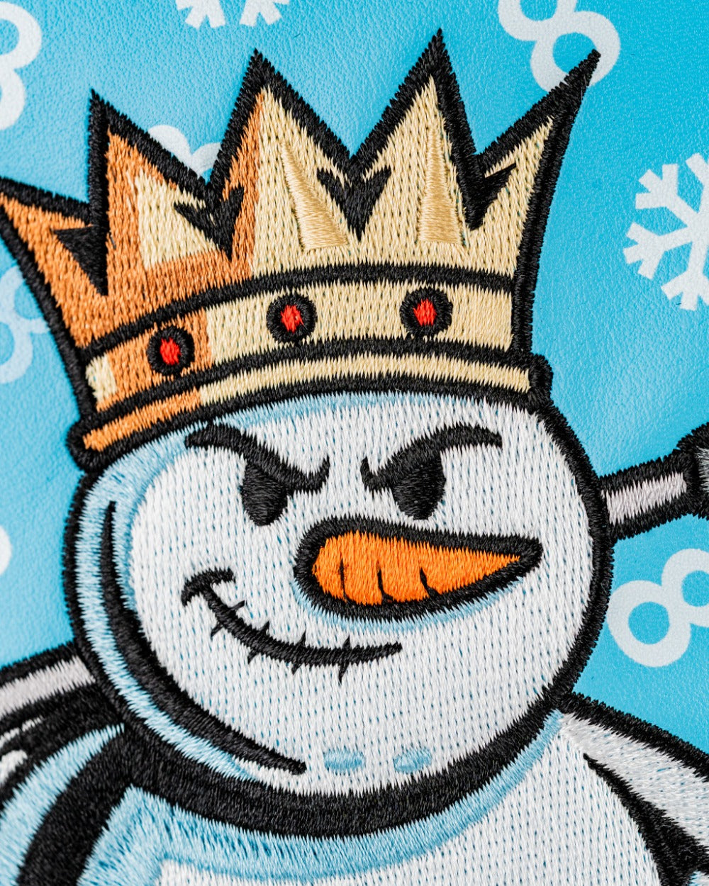 Snowman driver cover featuring a crowned snowman with a mischievous expression on a light blue background.