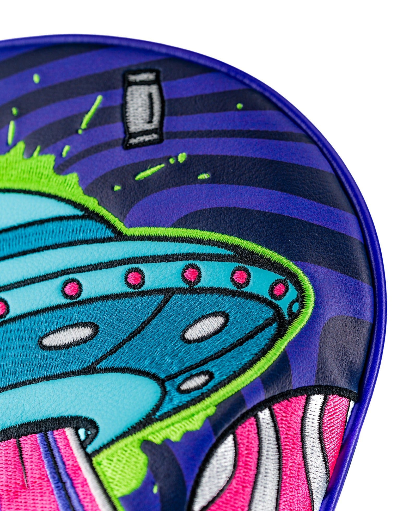 Bold alien-themed driver cover featuring a colorful UFO design with vibrant details and a playful aesthetic for golfers.