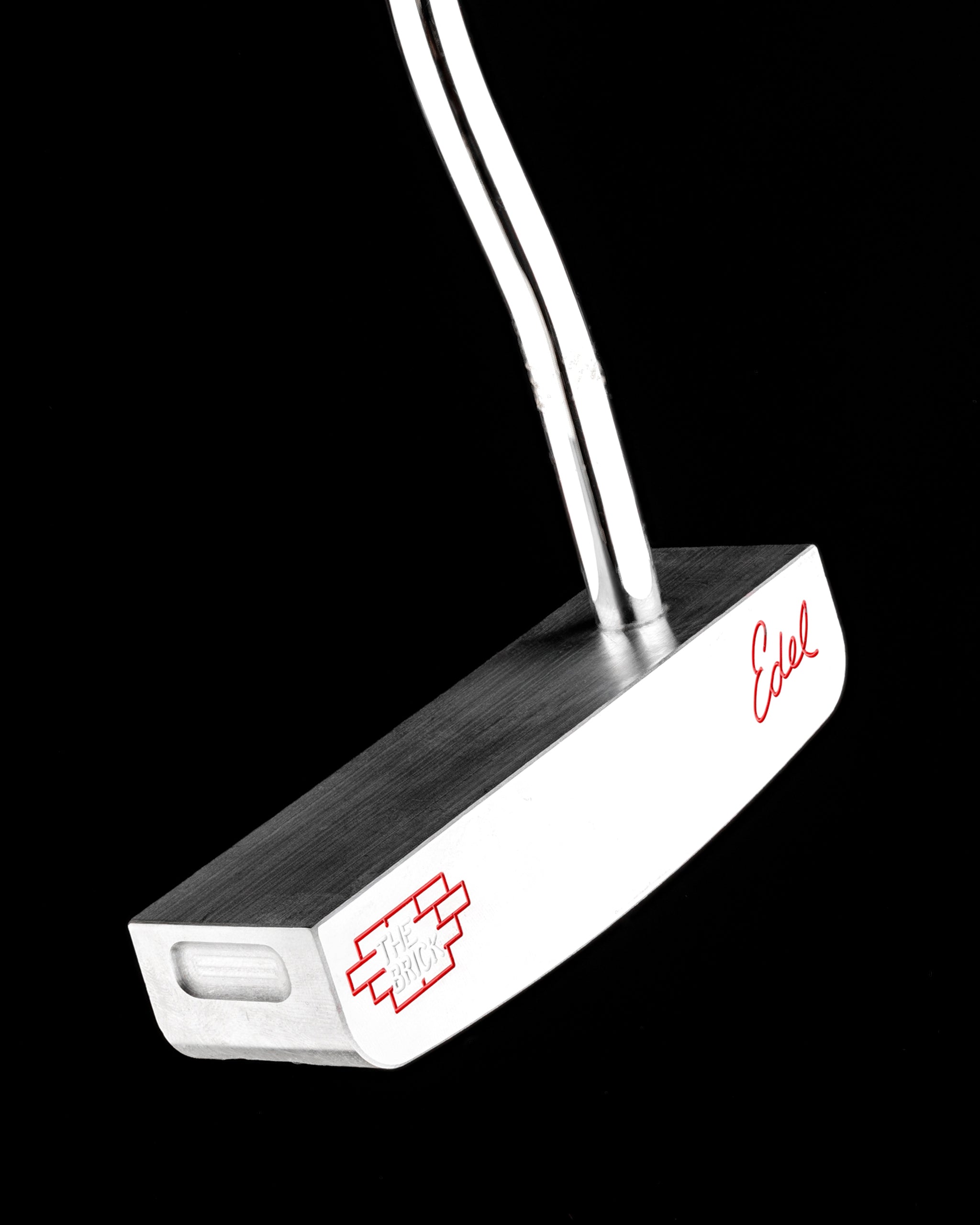 Sleek Edel Golf Blade Putter, The Brick, featuring a polished silver finish and distinctive logo for precision putting.