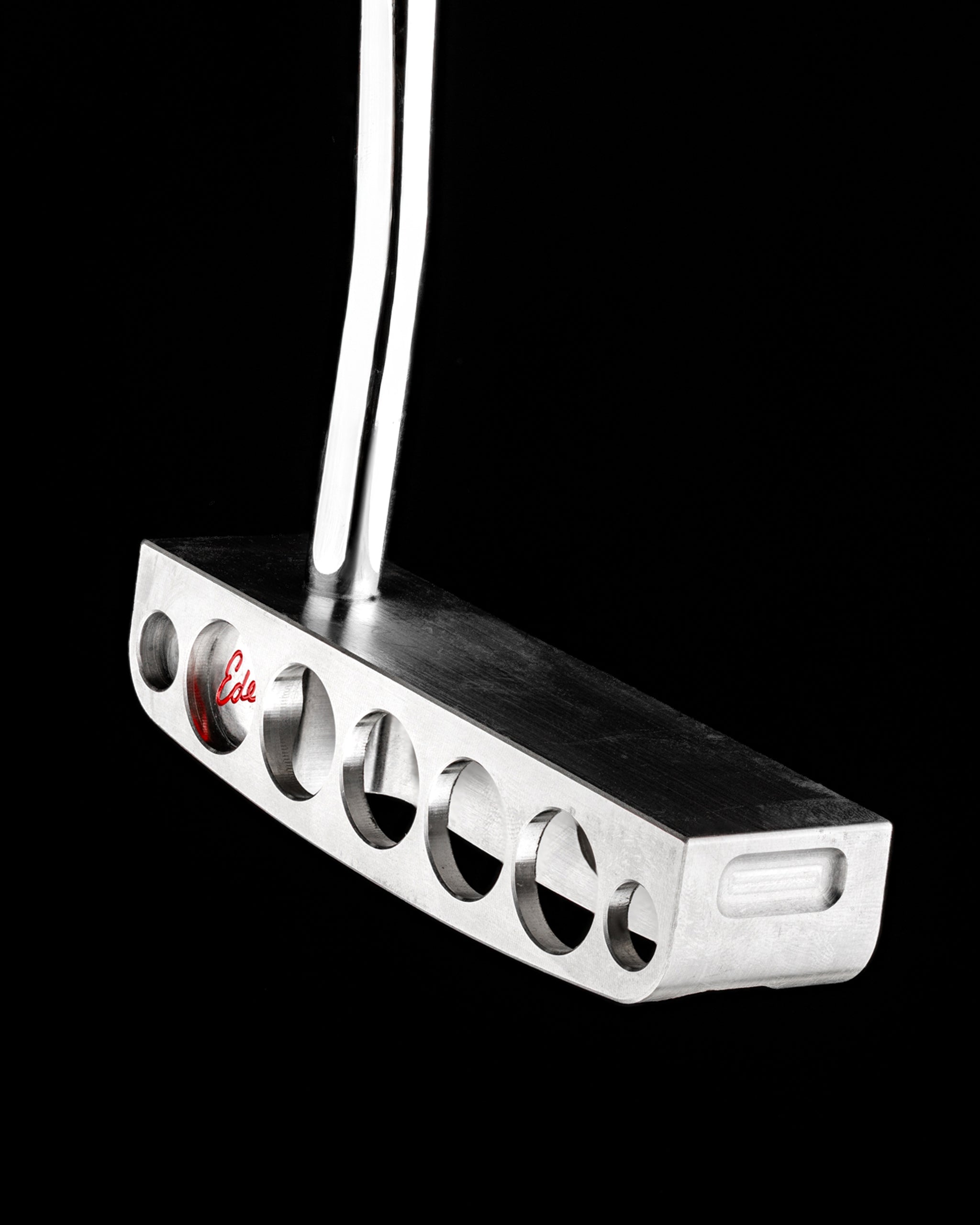 Sleek Edel Golf Blade Putter with a unique design featuring precision cutouts for enhanced performance on the green.