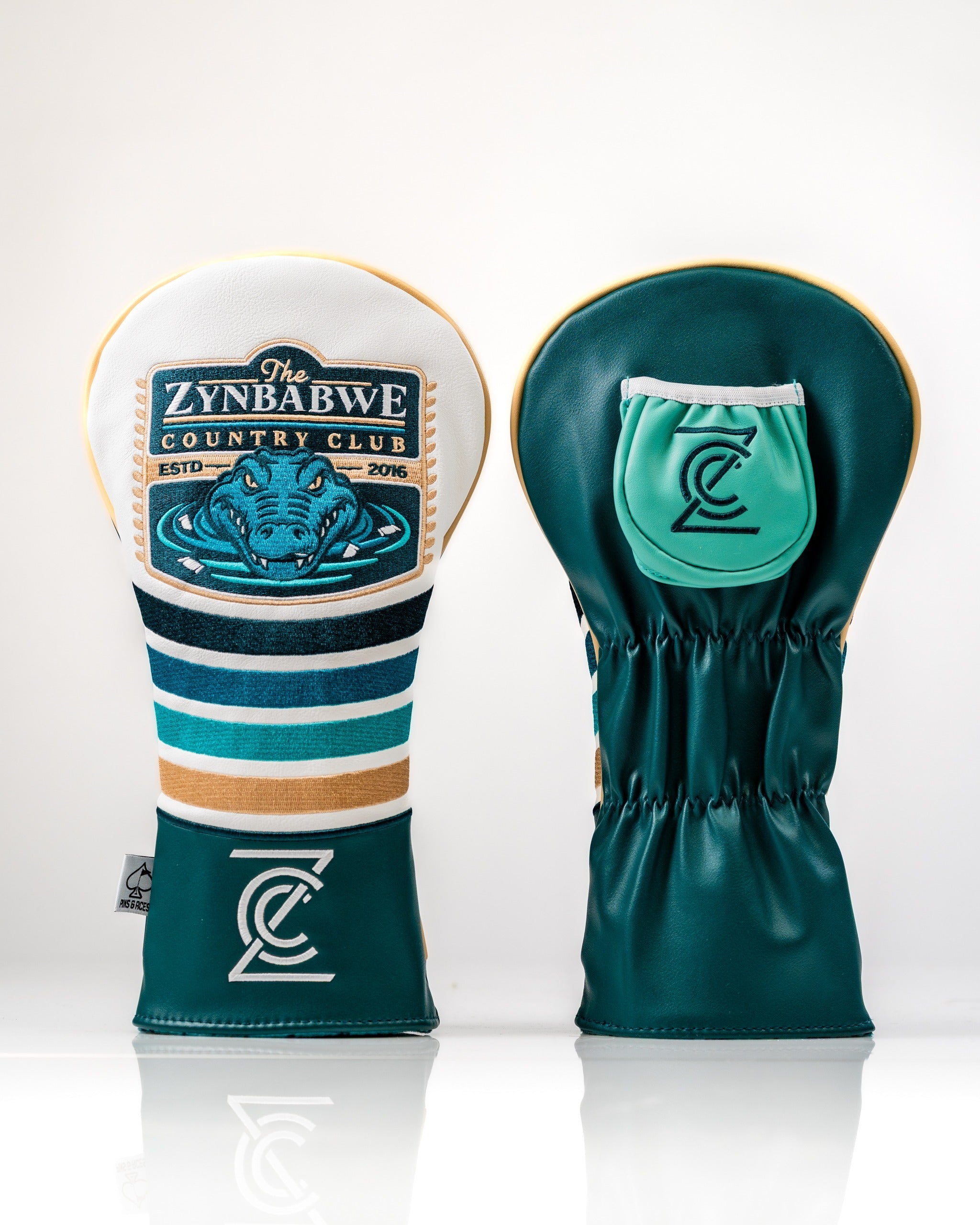Bold driver cover featuring Zynbabwe Country Club design with a gator graphic and vibrant teal and cream colors.