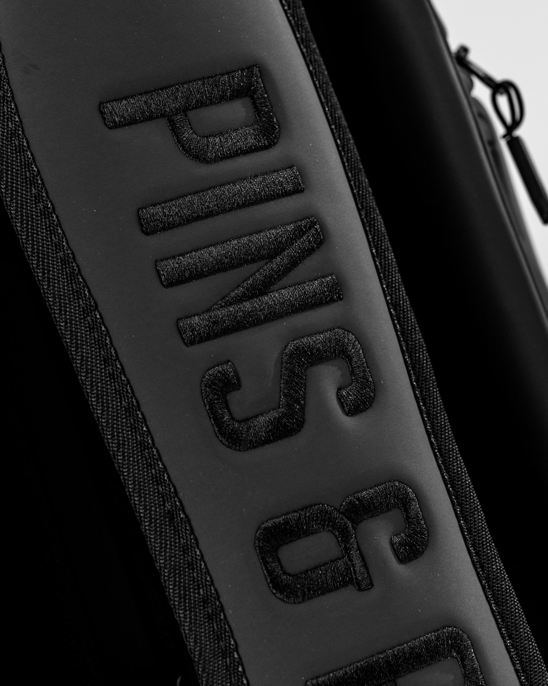 Black Player Preferred™ Cart Bag featuring bold "PINS & ACES" branding, designed for stylish golfers on the course.