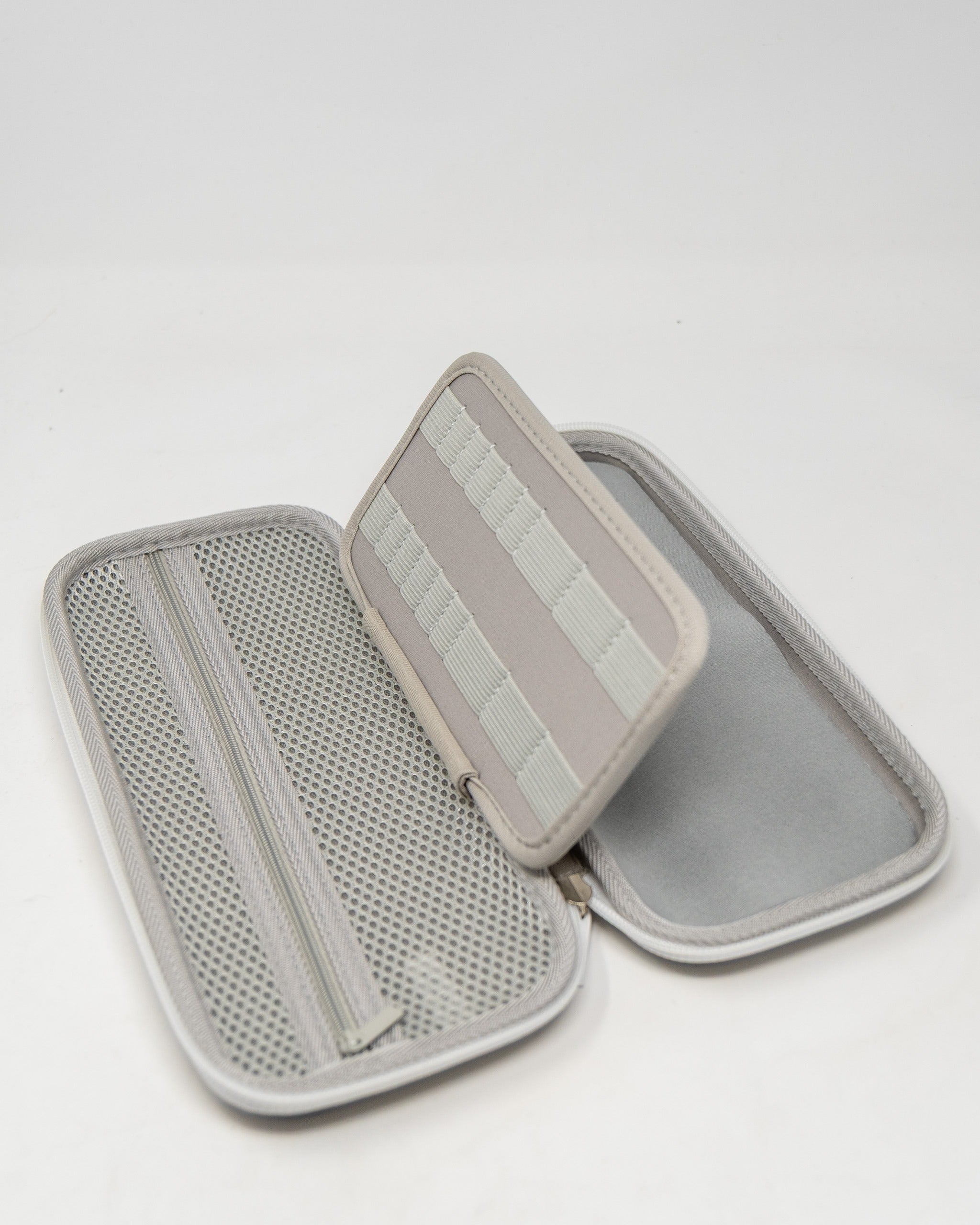 Gray glove and accessory caddie featuring a zippered closure and multiple compartments for organized storage.