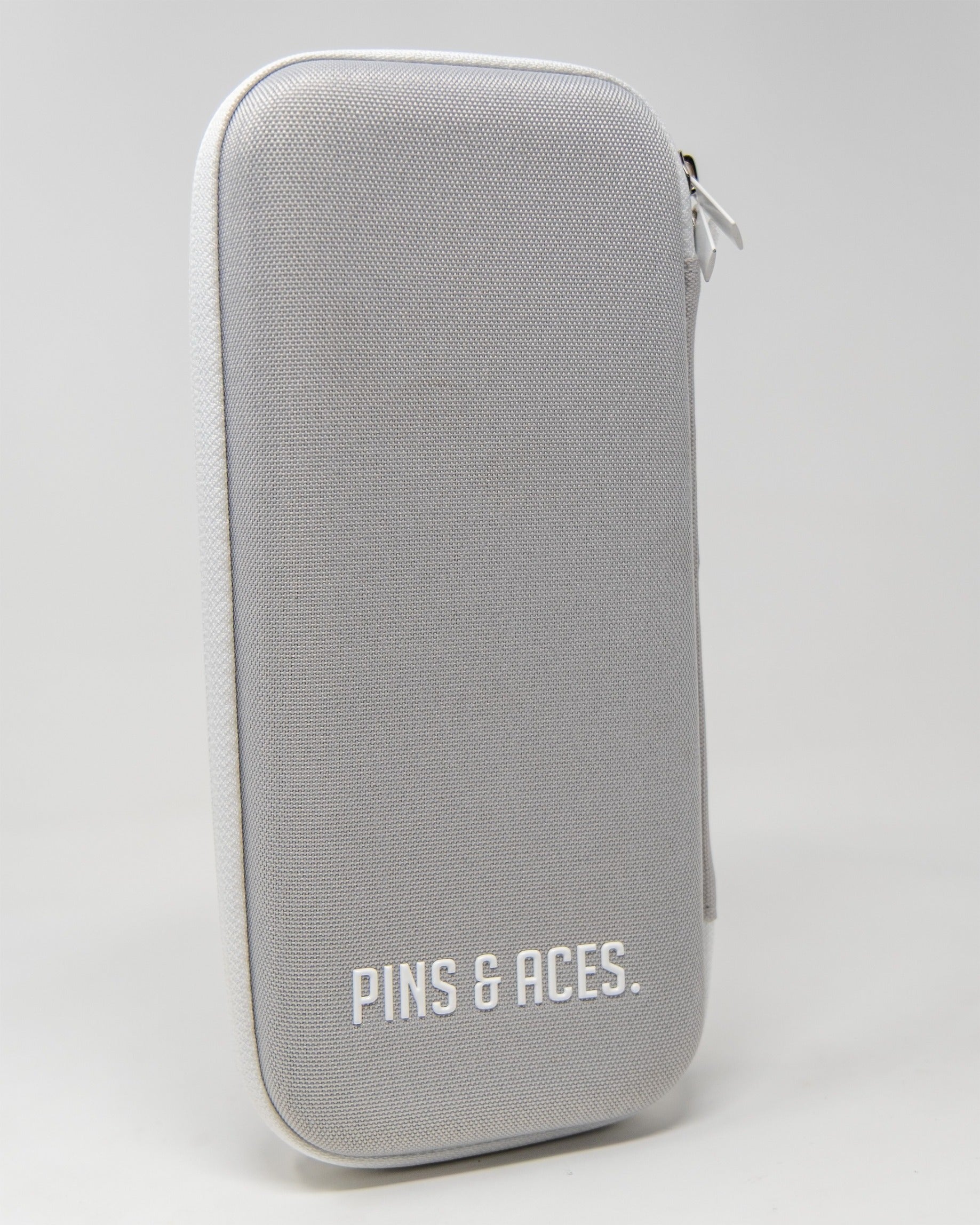 Gray glove and accessory caddie featuring a sleek design and the Pins & Aces logo, ideal for organized golf gear storage.