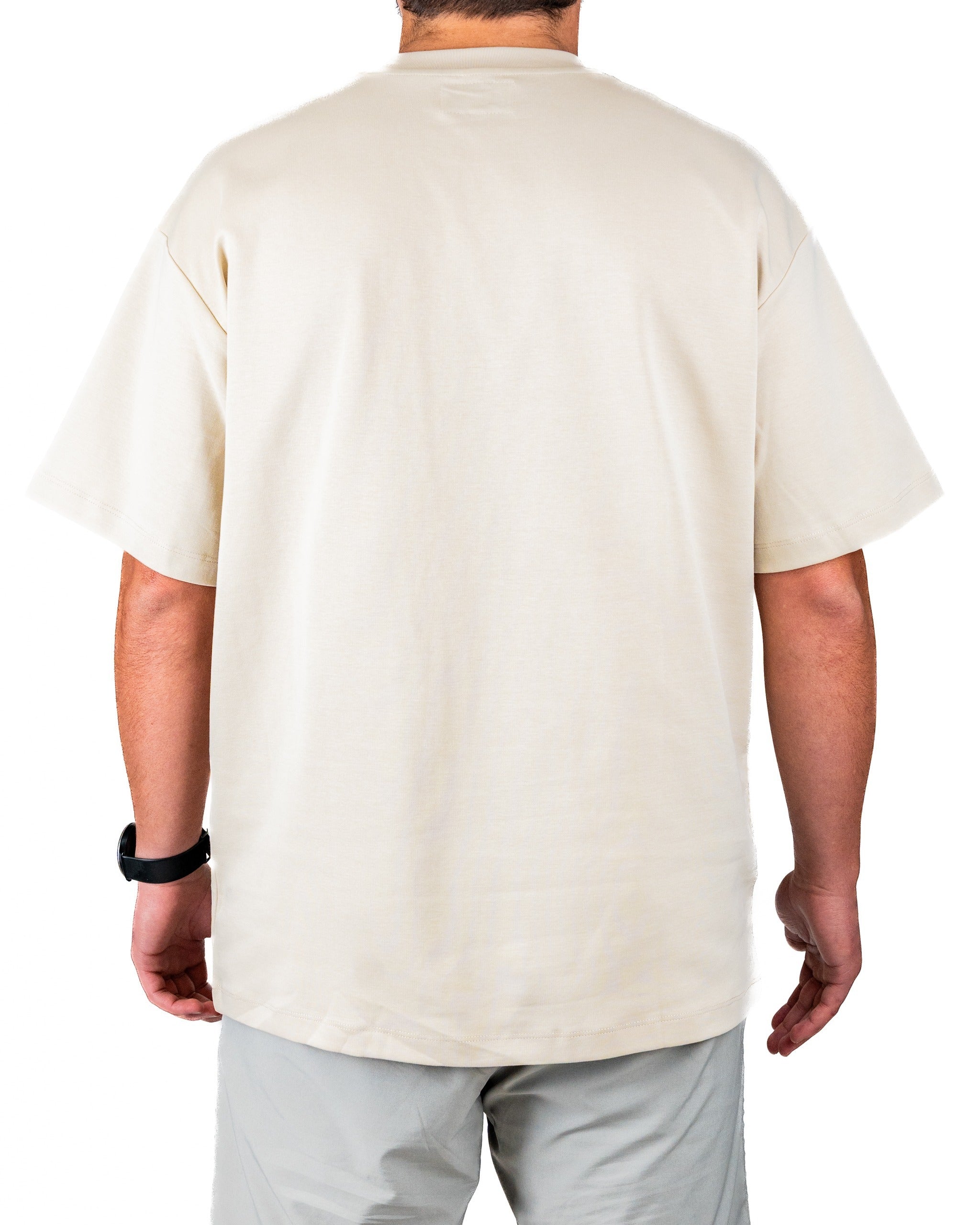 Cream embossed spade tee shirt displayed from the back, featuring a relaxed fit and soft fabric, ideal for golfers.