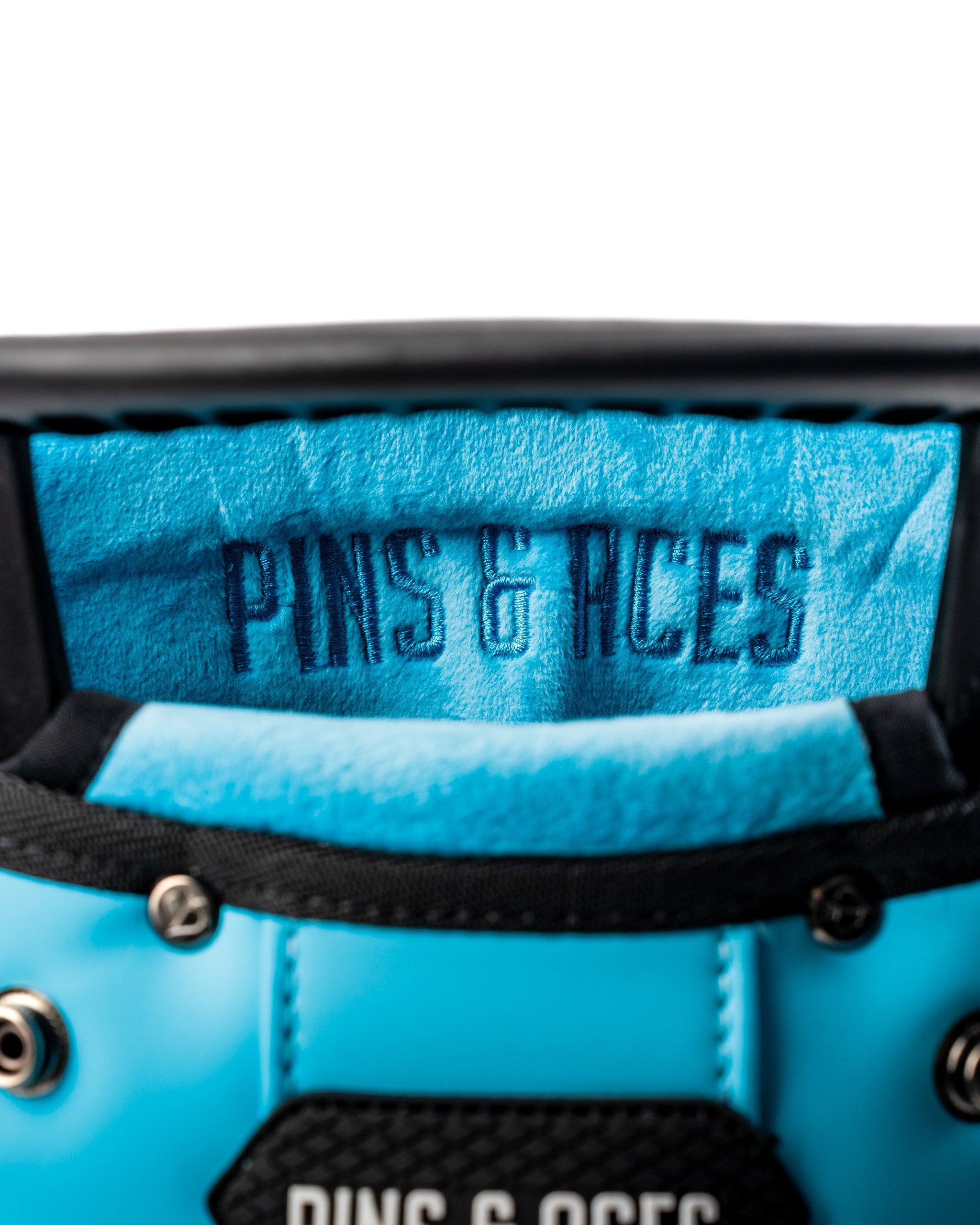 Interior view of the Player Preferred Golf Bag in Glacier, featuring a soft blue lining with the Pins & Aces logo.
