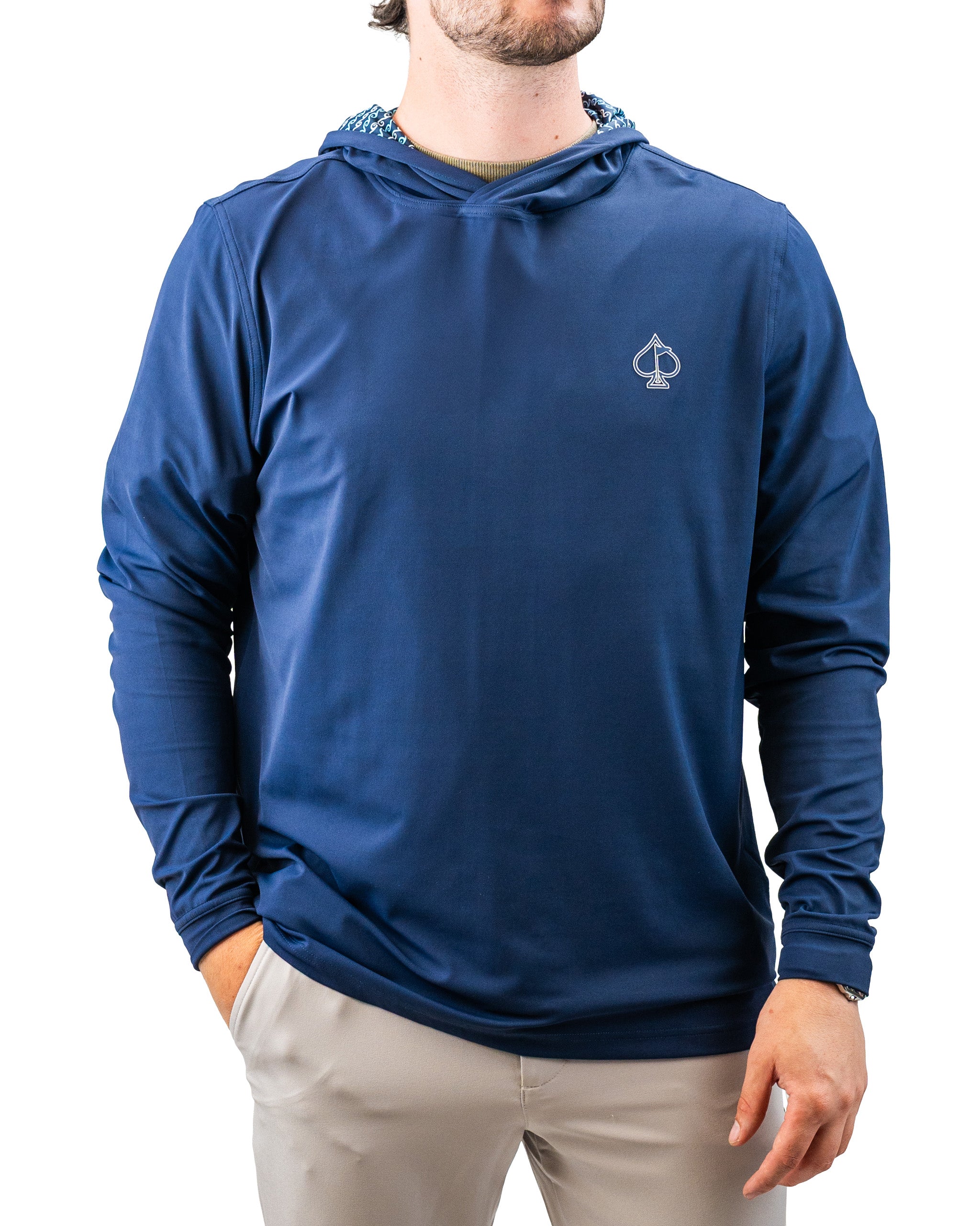 Blue lightweight hoodie with a small spade logo, featuring a patterned lining inside the hood, perfect for bold golf style.