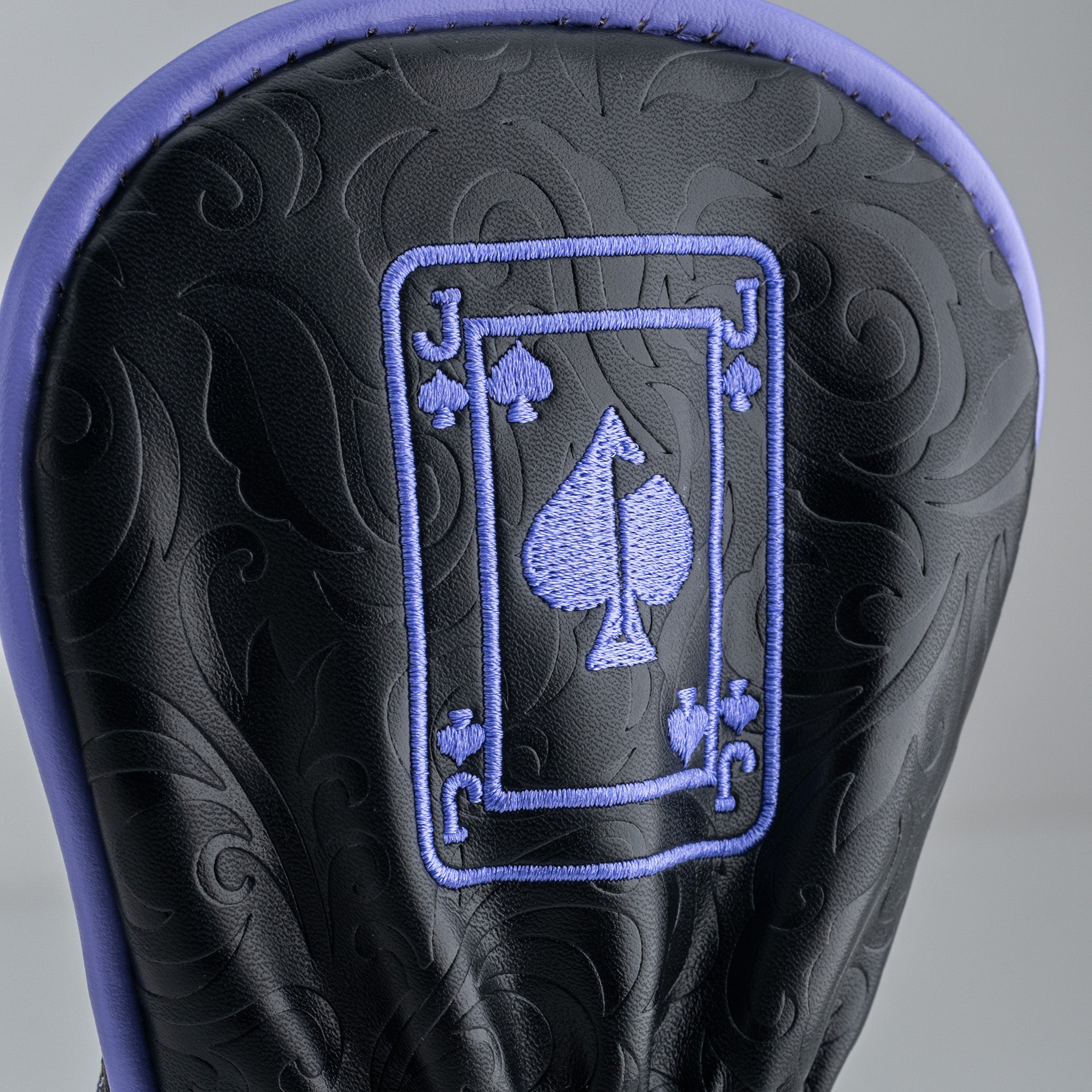Royal Flush Headcover Set featuring a black leather design with elegant purple embroidered spade motif for stylish golf protection.