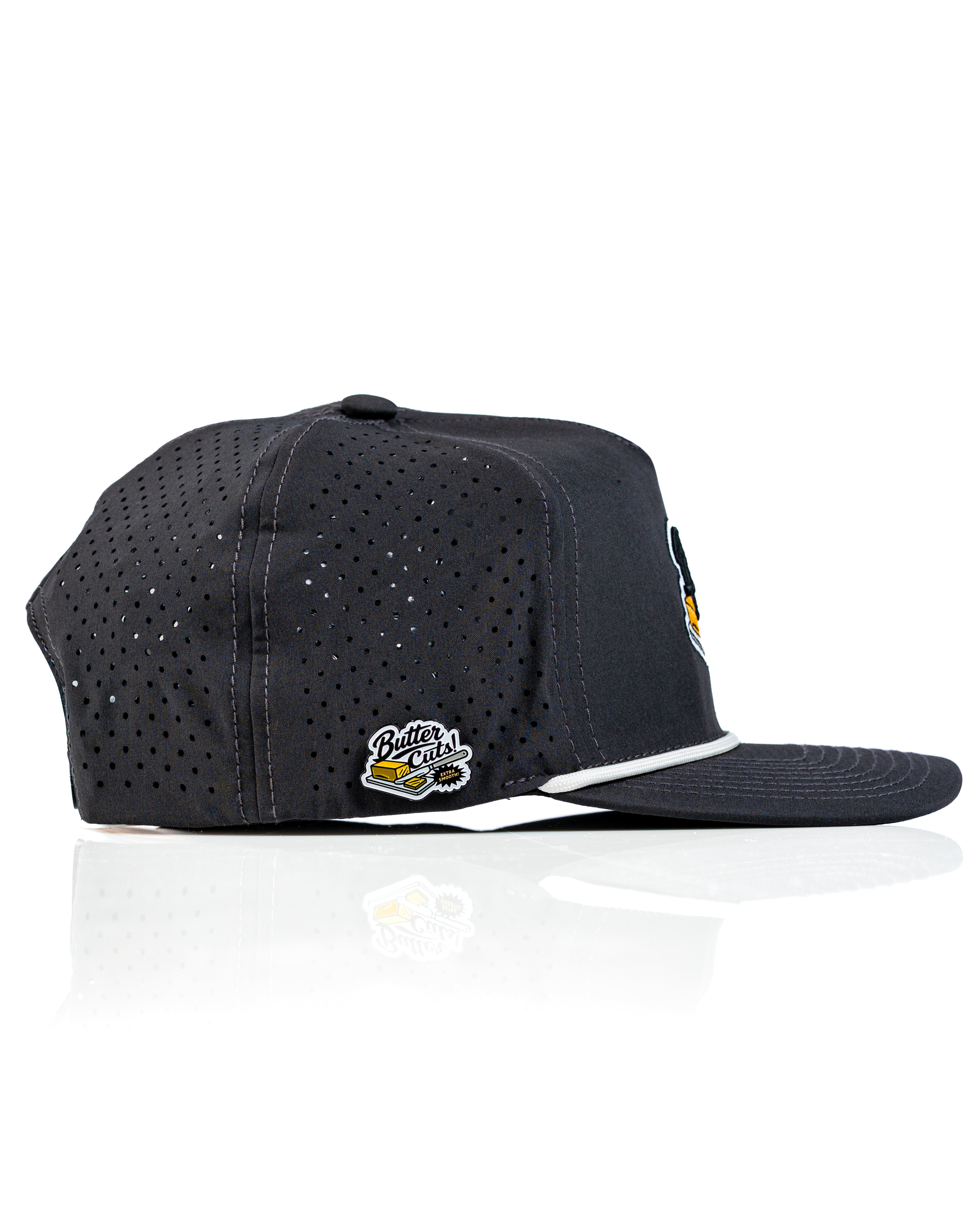 Perforated Rope Hat in black with a Butter Cut logo, designed for stylish comfort on the golf course.