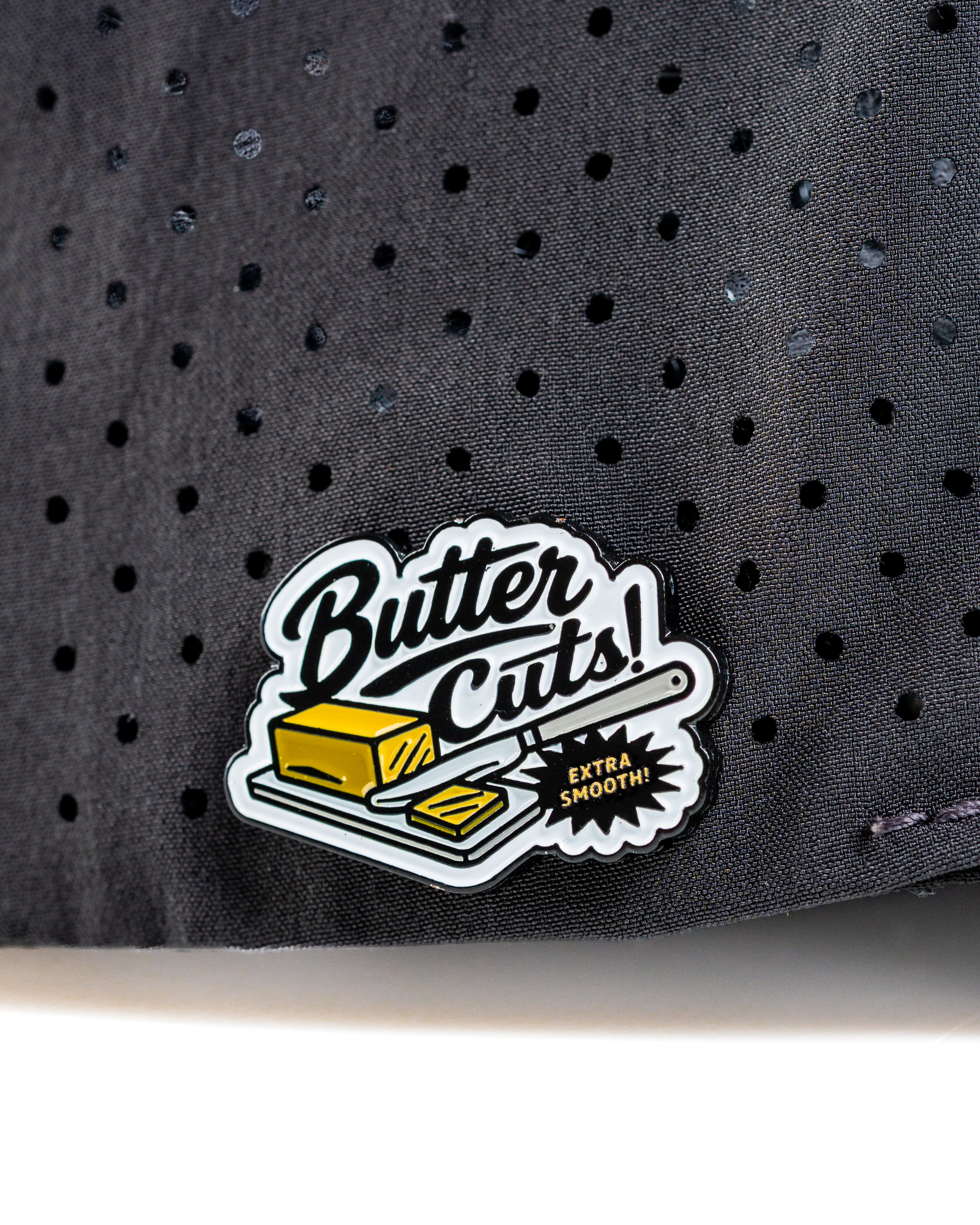 Perforated Rope Hat featuring a "Butter Cuts" patch, designed for stylish golfers seeking comfort and breathability.