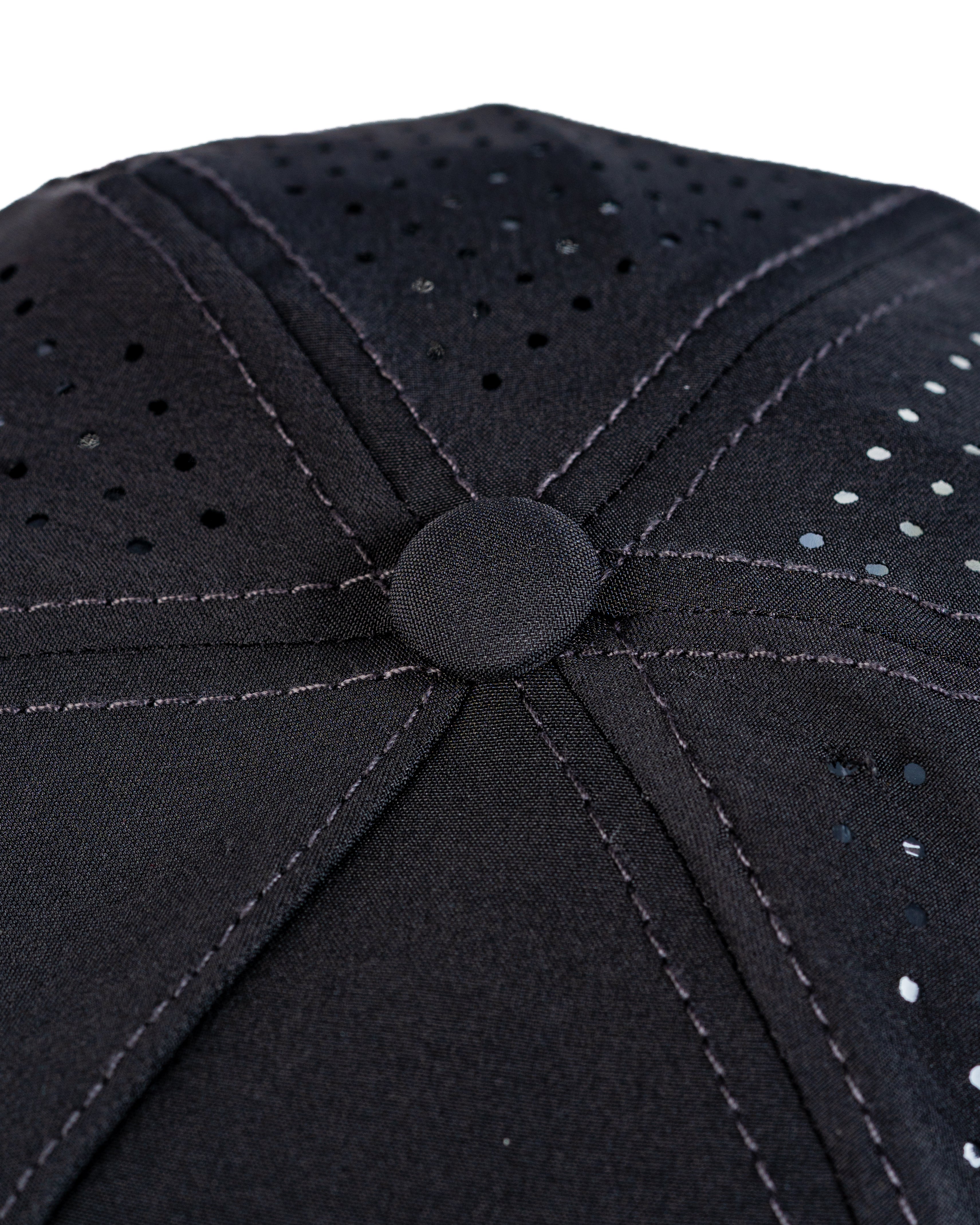 Perforated black rope hat featuring a stylish design and breathable fabric for comfort on the golf course.
