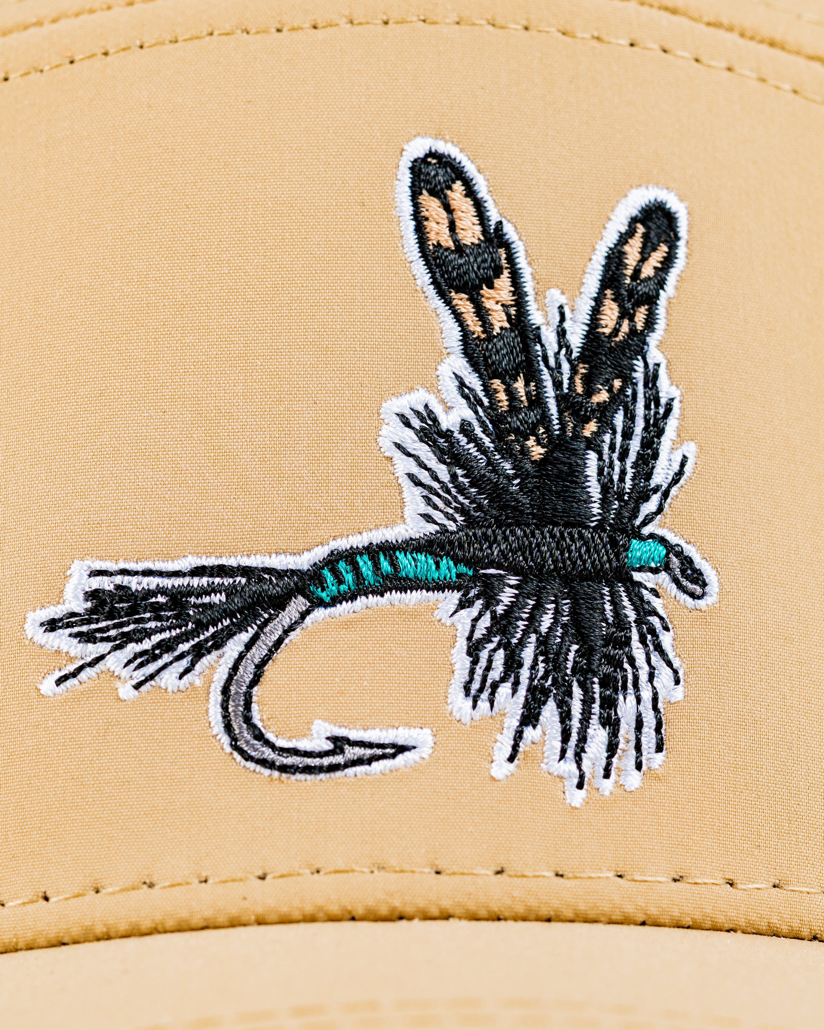 Embroidered Tradesman Hat featuring a detailed dry fly design, perfect for stylish golfers and outdoor enthusiasts.