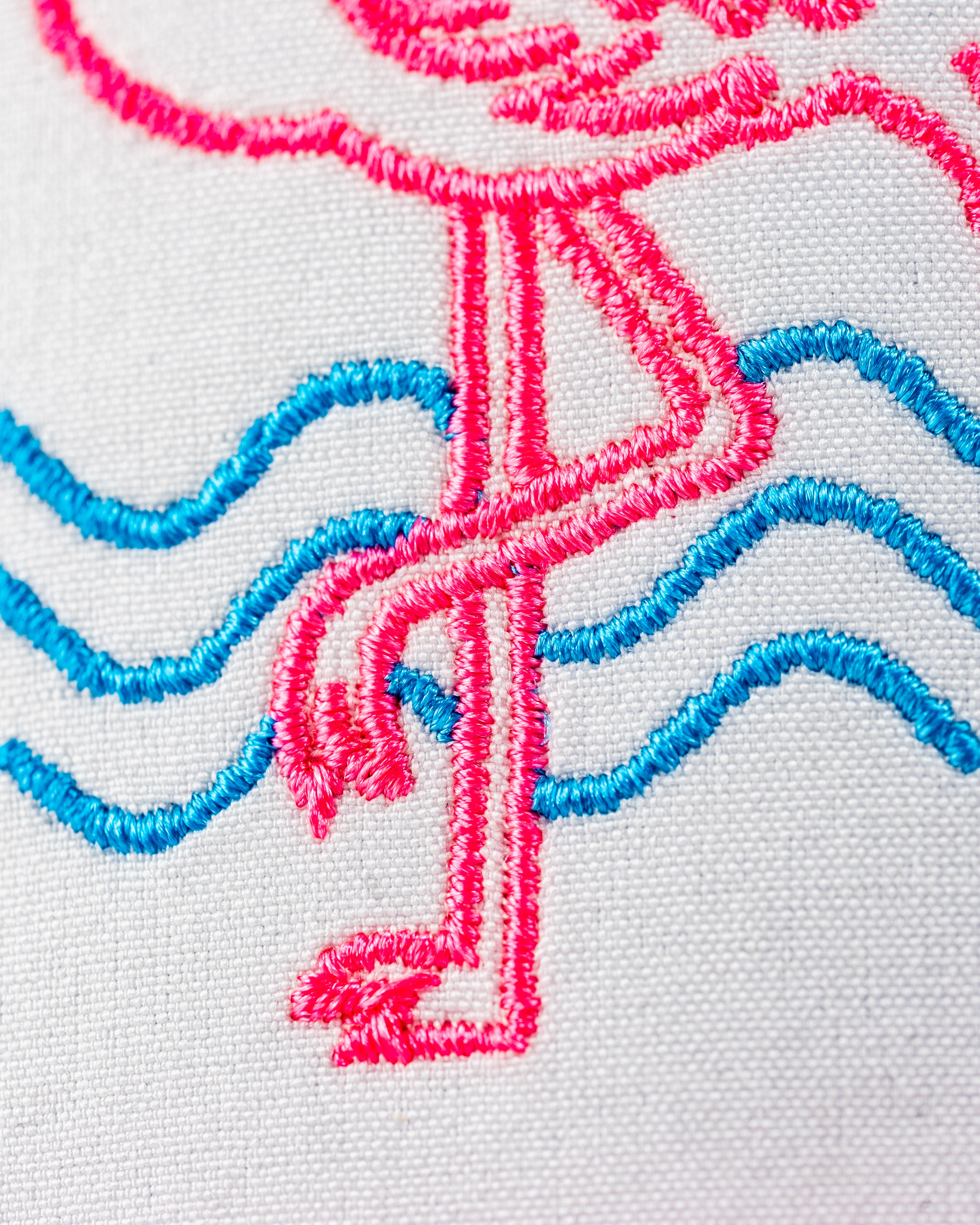 Perforated Rope Hat featuring a vibrant flamingo design with pink and blue embroidery on a light background.