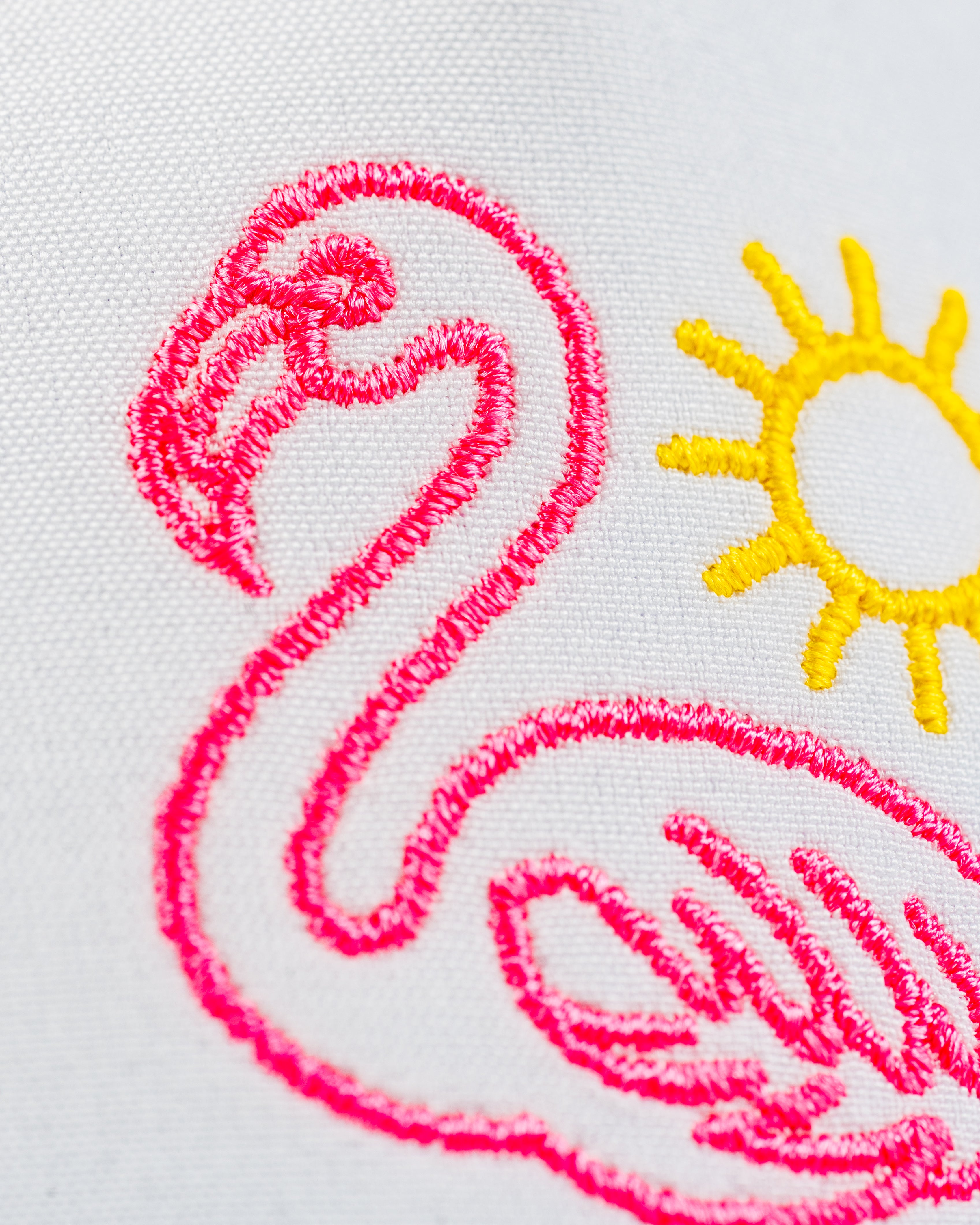 Perforated rope hat featuring a vibrant flamingo design and sun embroidery, perfect for stylish golfers.