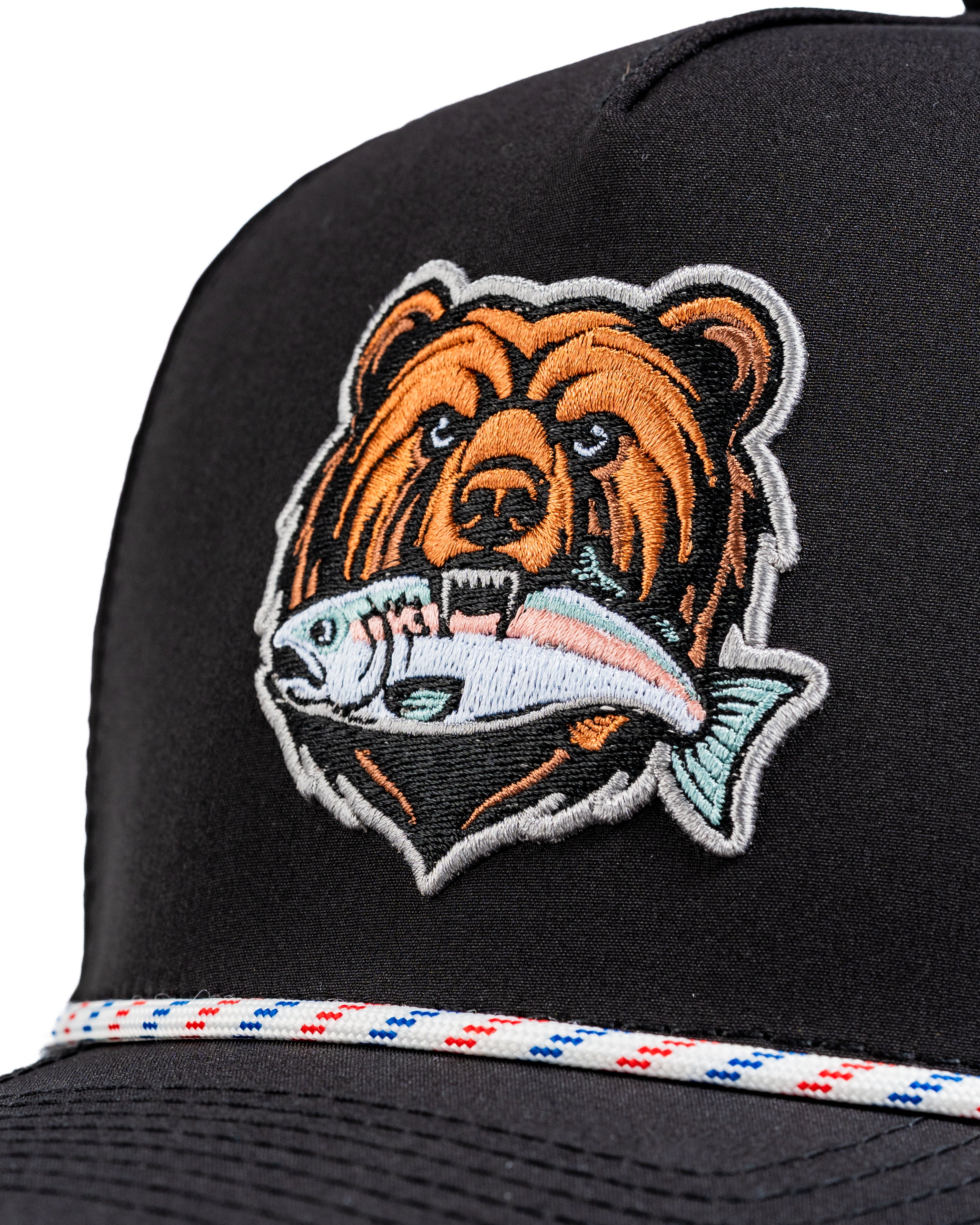Perforated Rope Hat featuring a detailed embroidered grizzly bear holding a fish, perfect for stylish golfers.