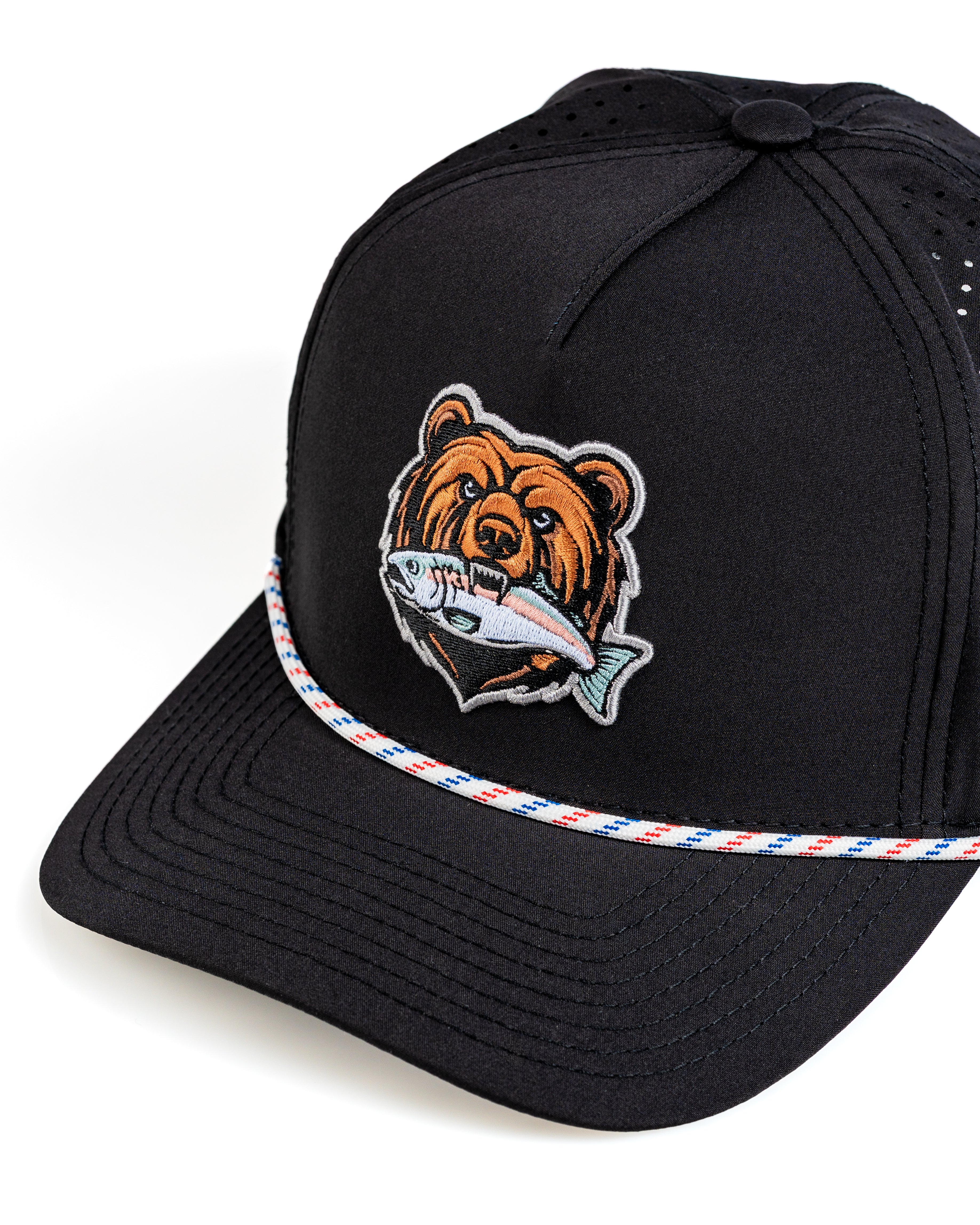 Perforated black rope hat featuring a bear logo and fish design, perfect for stylish golfers on the course.