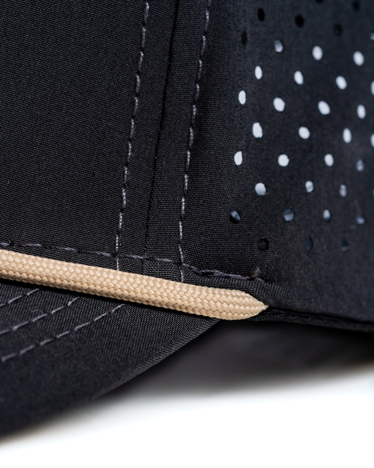 Close-up of the Perforated Rope Hat in Mallard, showcasing its breathable fabric and stylish design details.