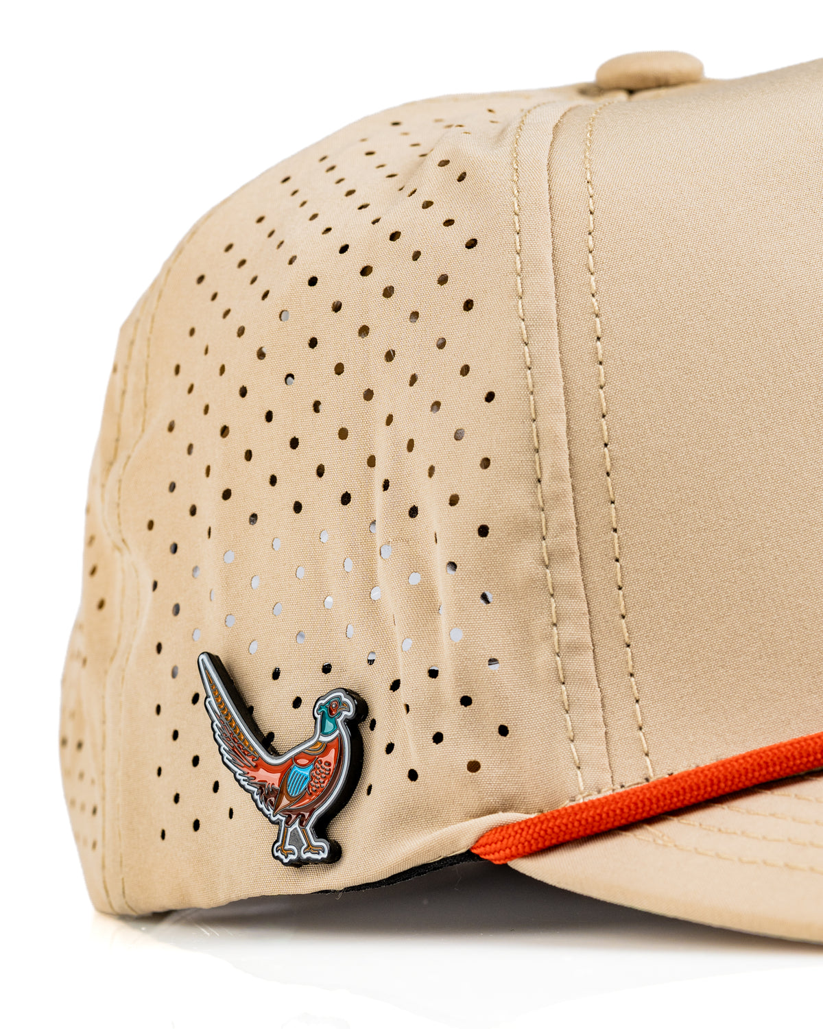 Perforated beige rope hat featuring a colorful pheasant emblem and an orange accent band for a stylish golf look.