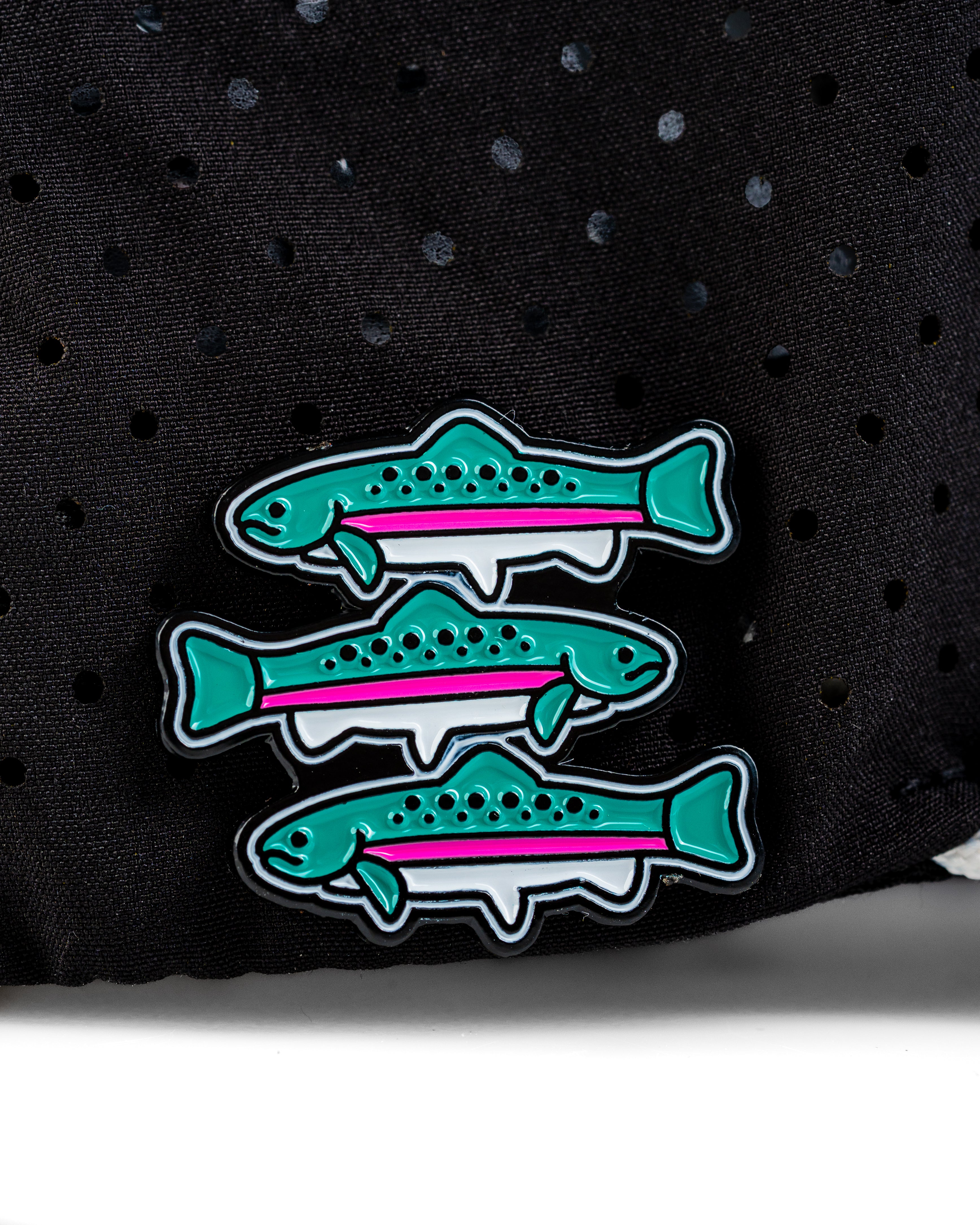 Perforated rope hat featuring three colorful fish pins, perfect for stylish golfers who love unique accessories.