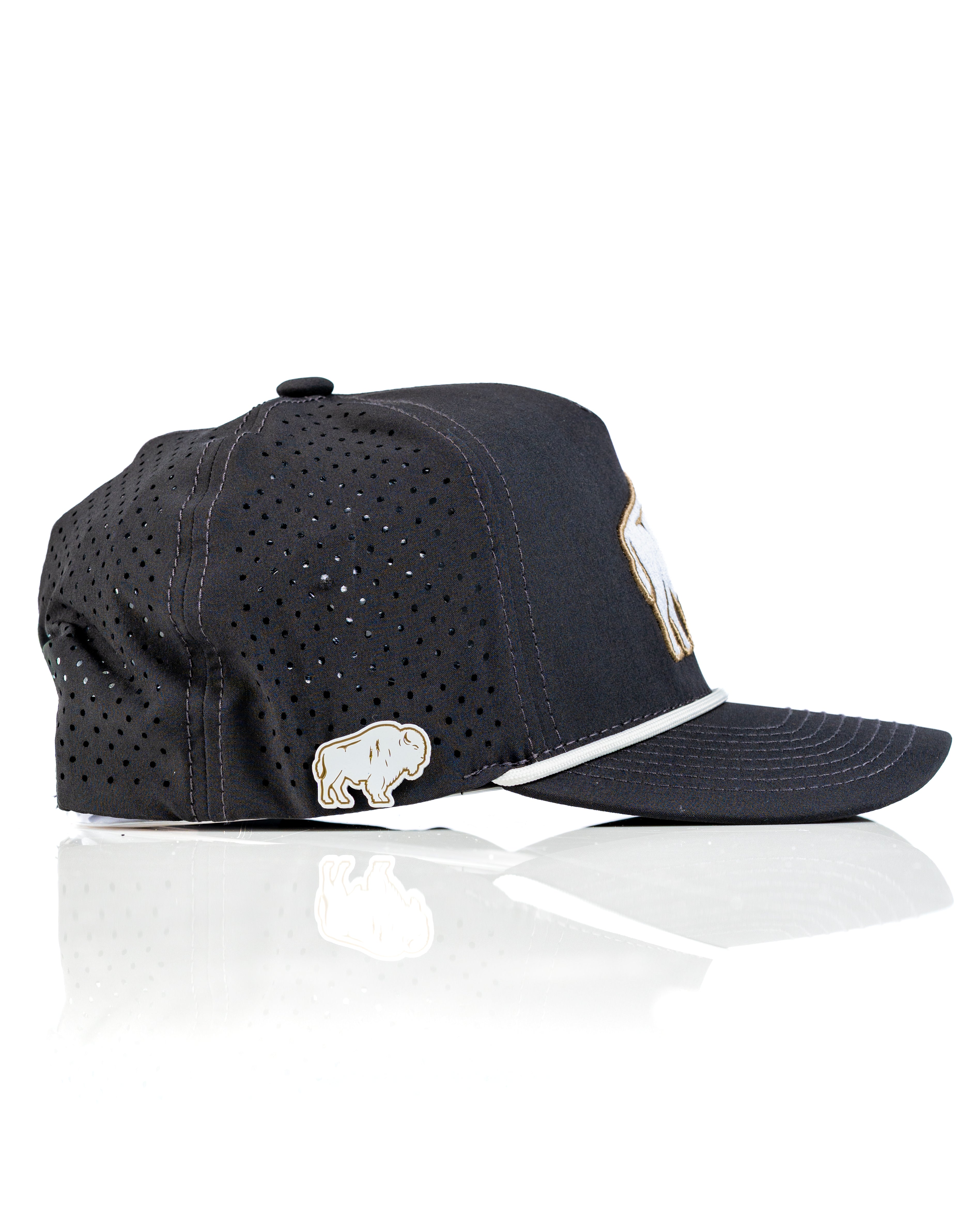 Perforated rope hat in black featuring a Great White Buffalo design and a decorative bison pin on the side.