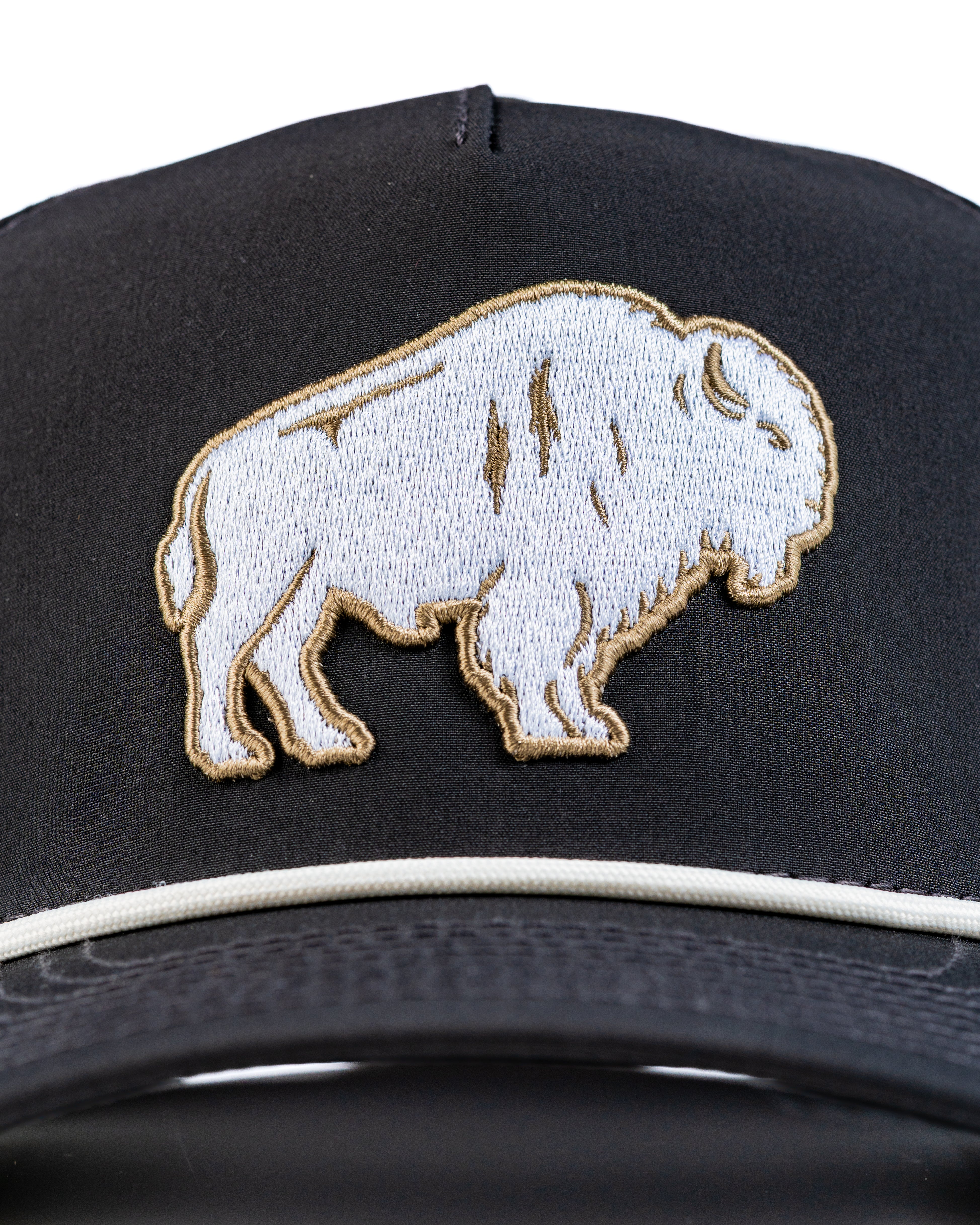Perforated Rope Hat featuring a detailed Great White Buffalo embroidery on a black background. Ideal for stylish golfers.