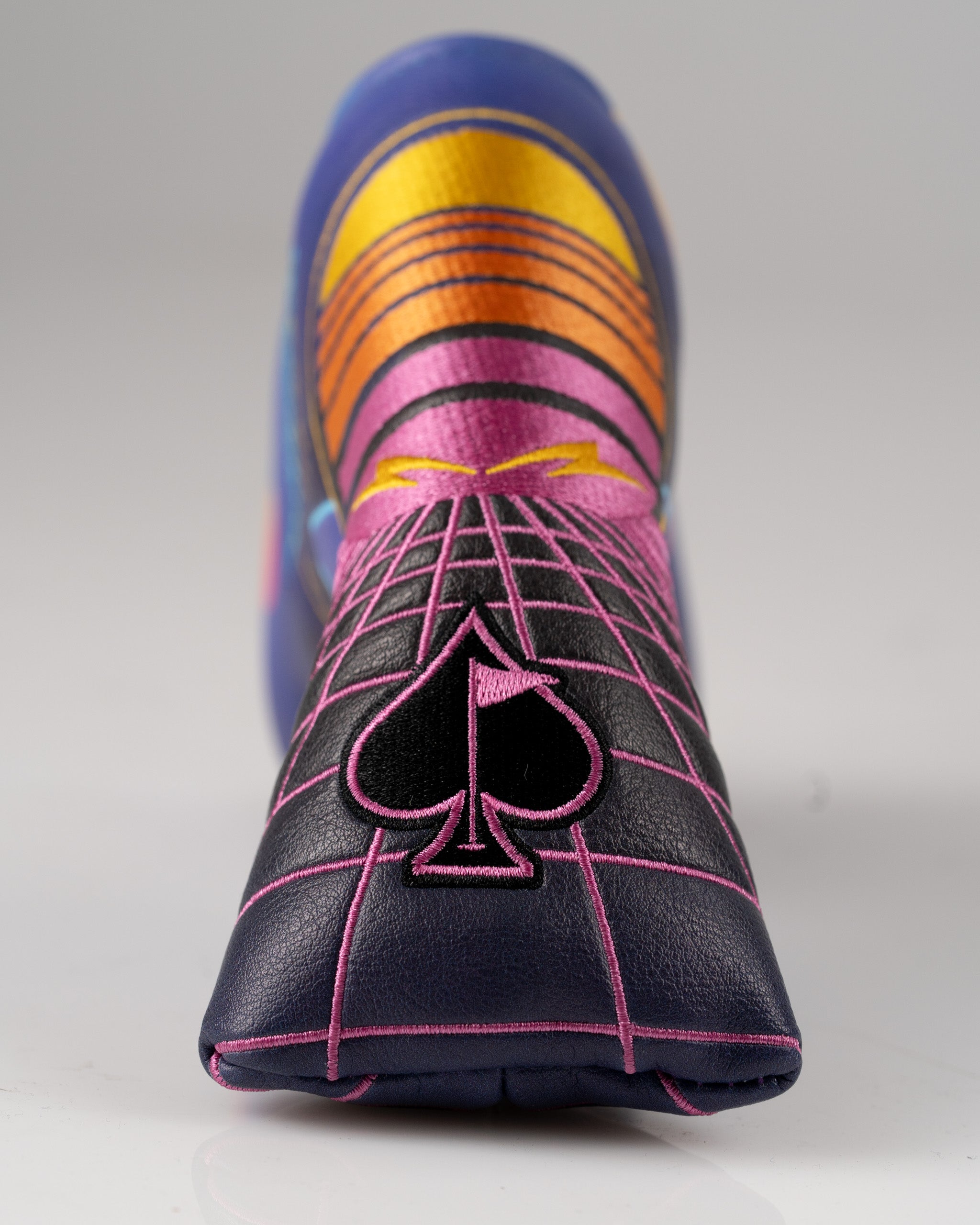 Bold Synthwave Blade Putter Cover featuring vibrant colors and a spade design, perfect for stylish golfers.
