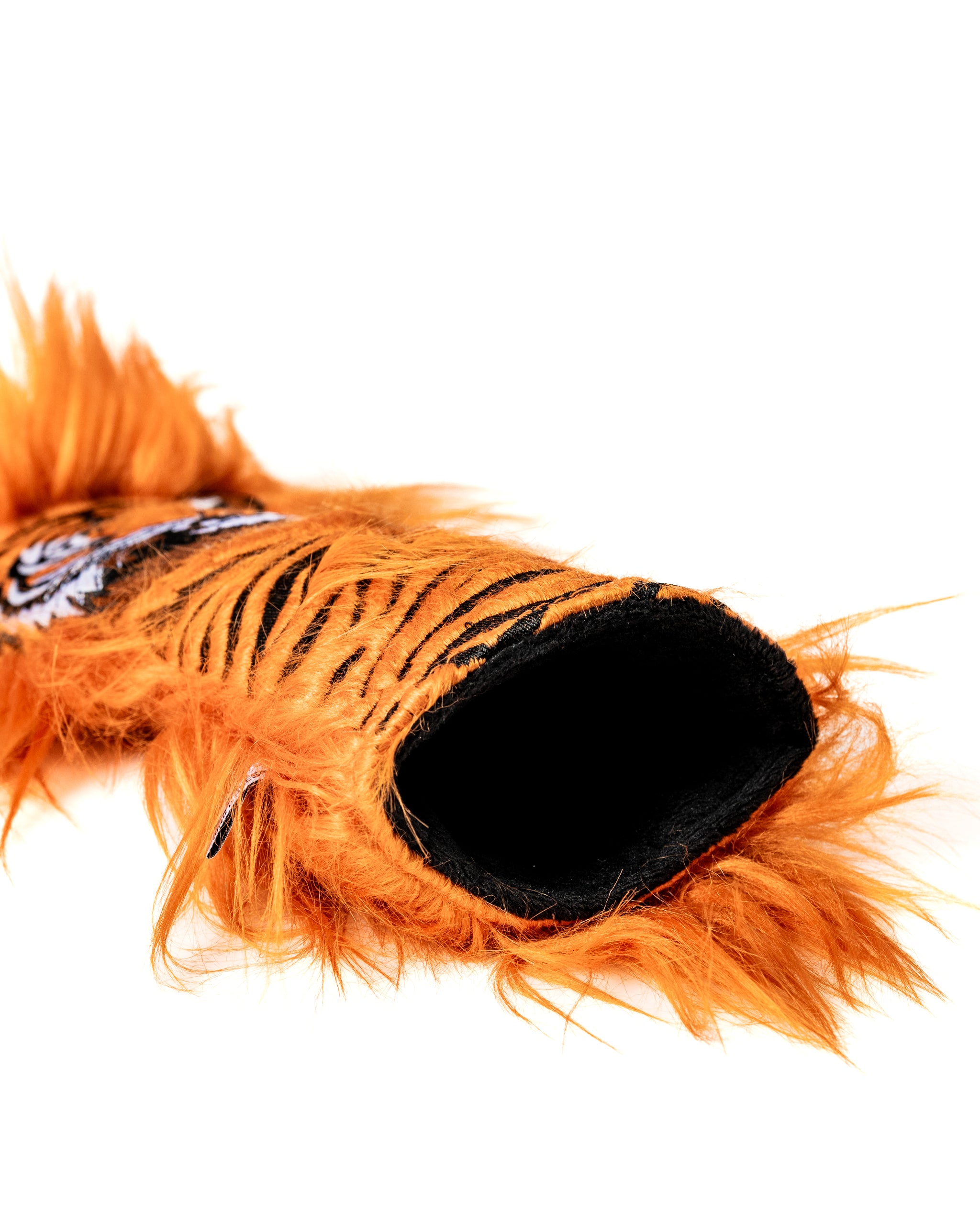 Bold tiger headcover set featuring vibrant orange fur and detailed stripes, designed to protect golf clubs in style.