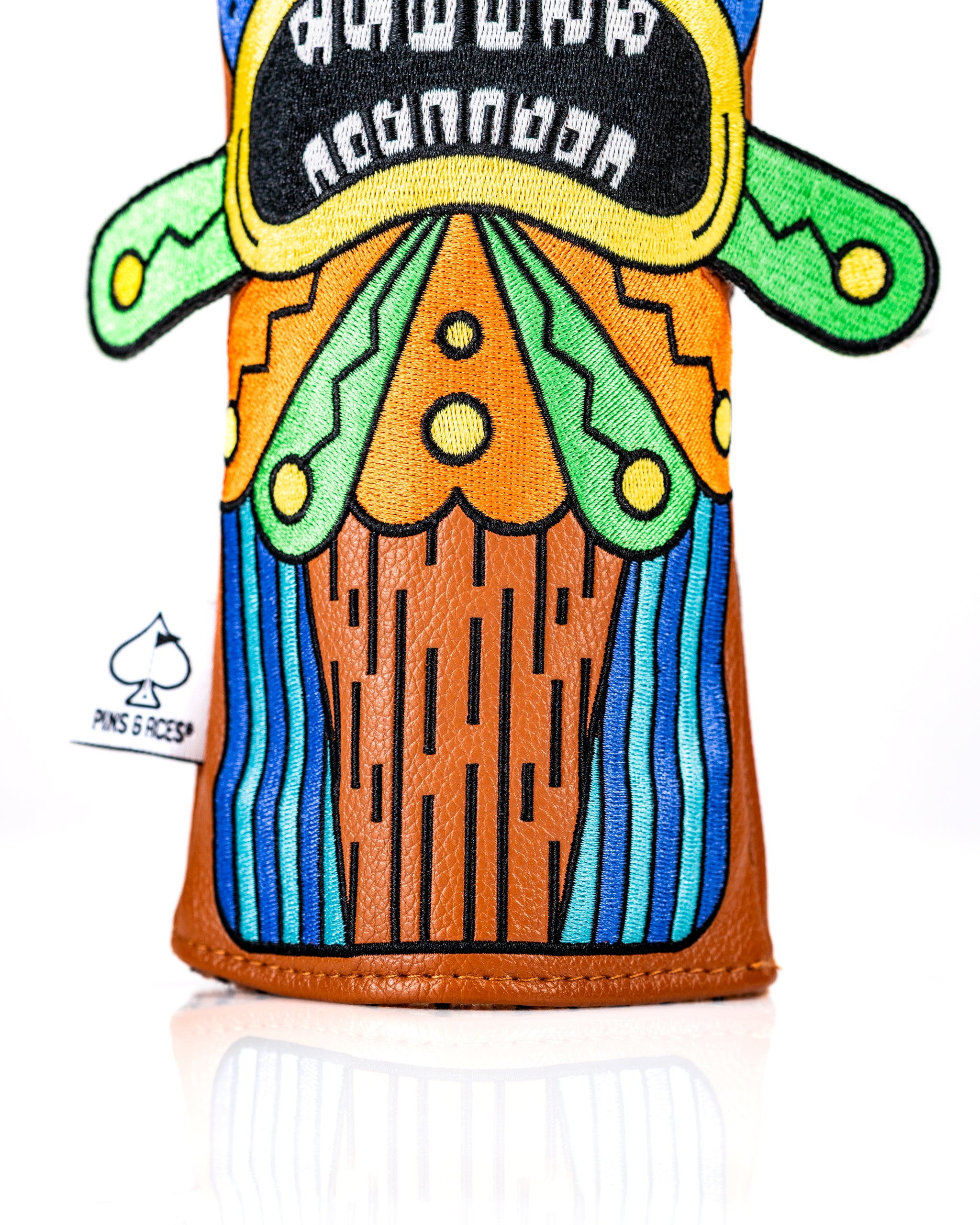 Colorful Tiki hybrid golf club cover featuring vibrant tropical designs and a unique, eye-catching pattern.