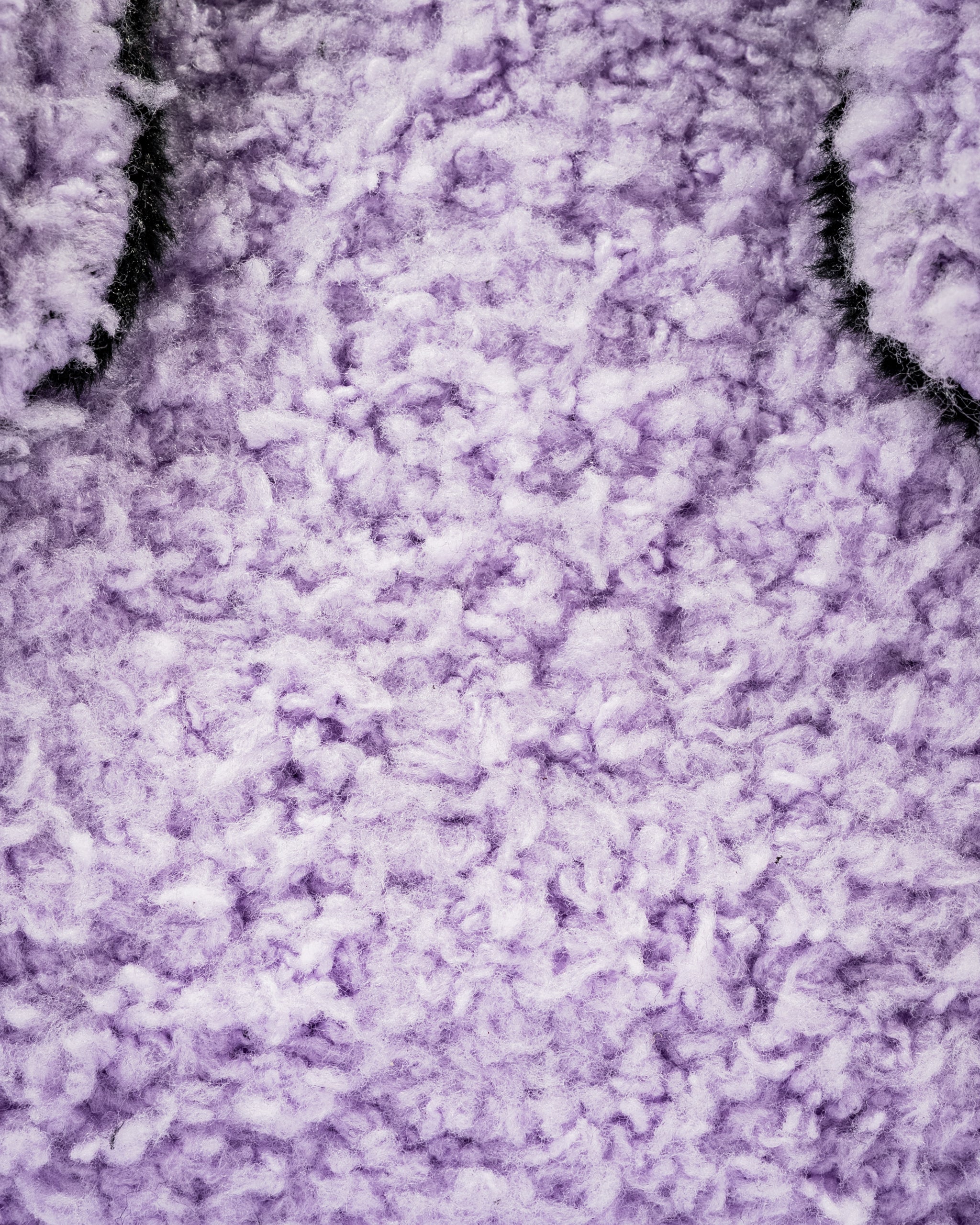 Purple, fluffy towel fabric of a South Park Towelie center shaft mallet putter cover designed for unique golf style.