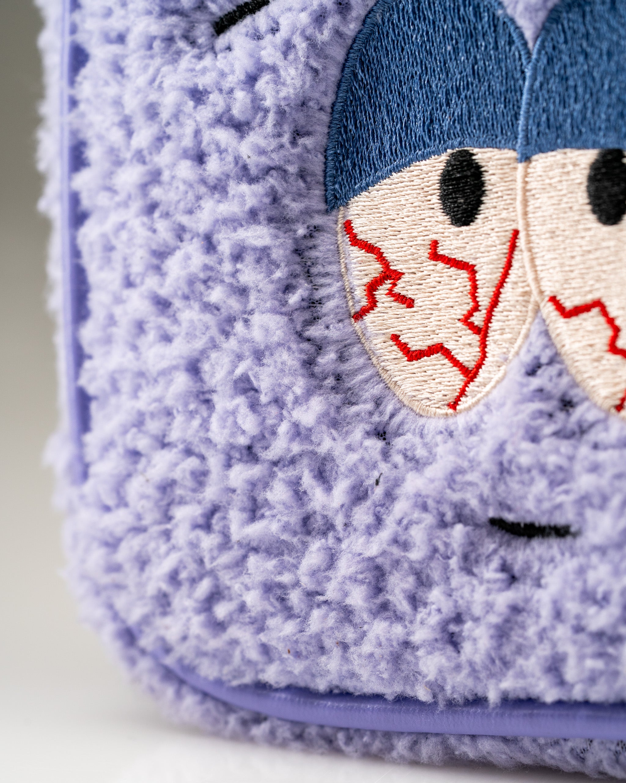South Park Towelie mallet putter cover featuring plush purple fabric and embroidered eyes, perfect for unique golf style.