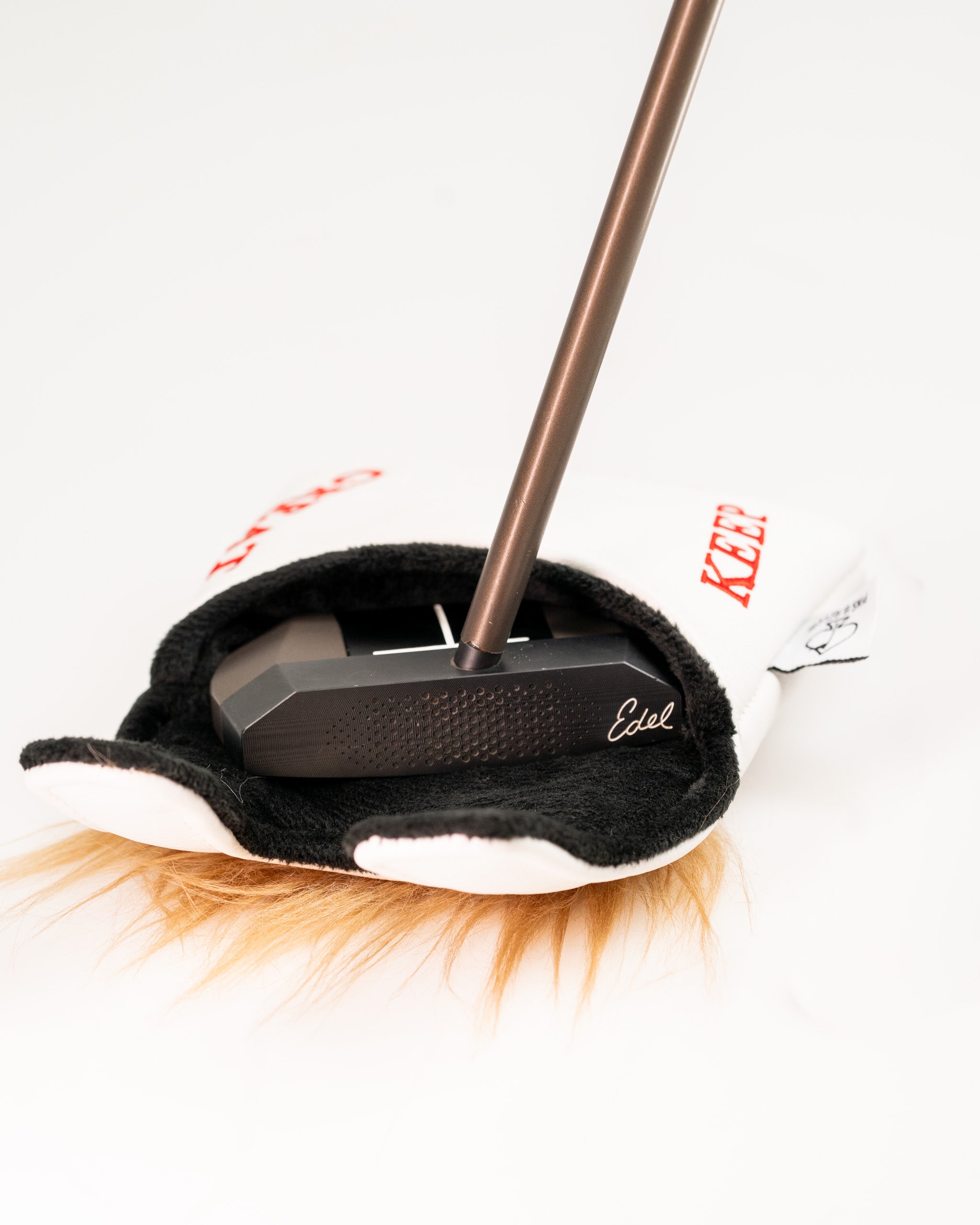 Center shaft mallet putter cover featuring a playful design, showcasing a unique style for golfers who want to stand out.