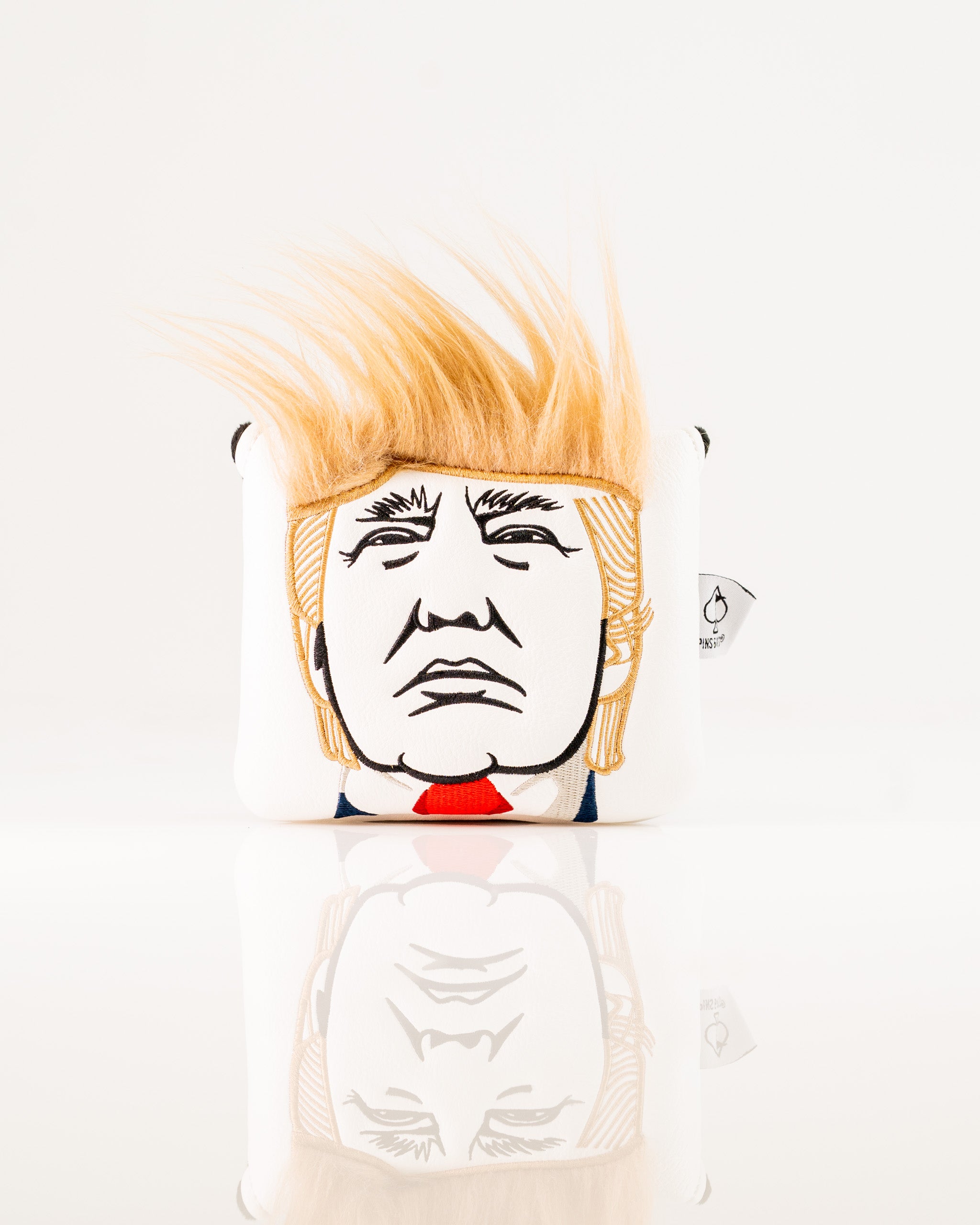 Bold Trump-themed center shaft mallet putter cover featuring iconic hairstyle and facial design for standout golf style.