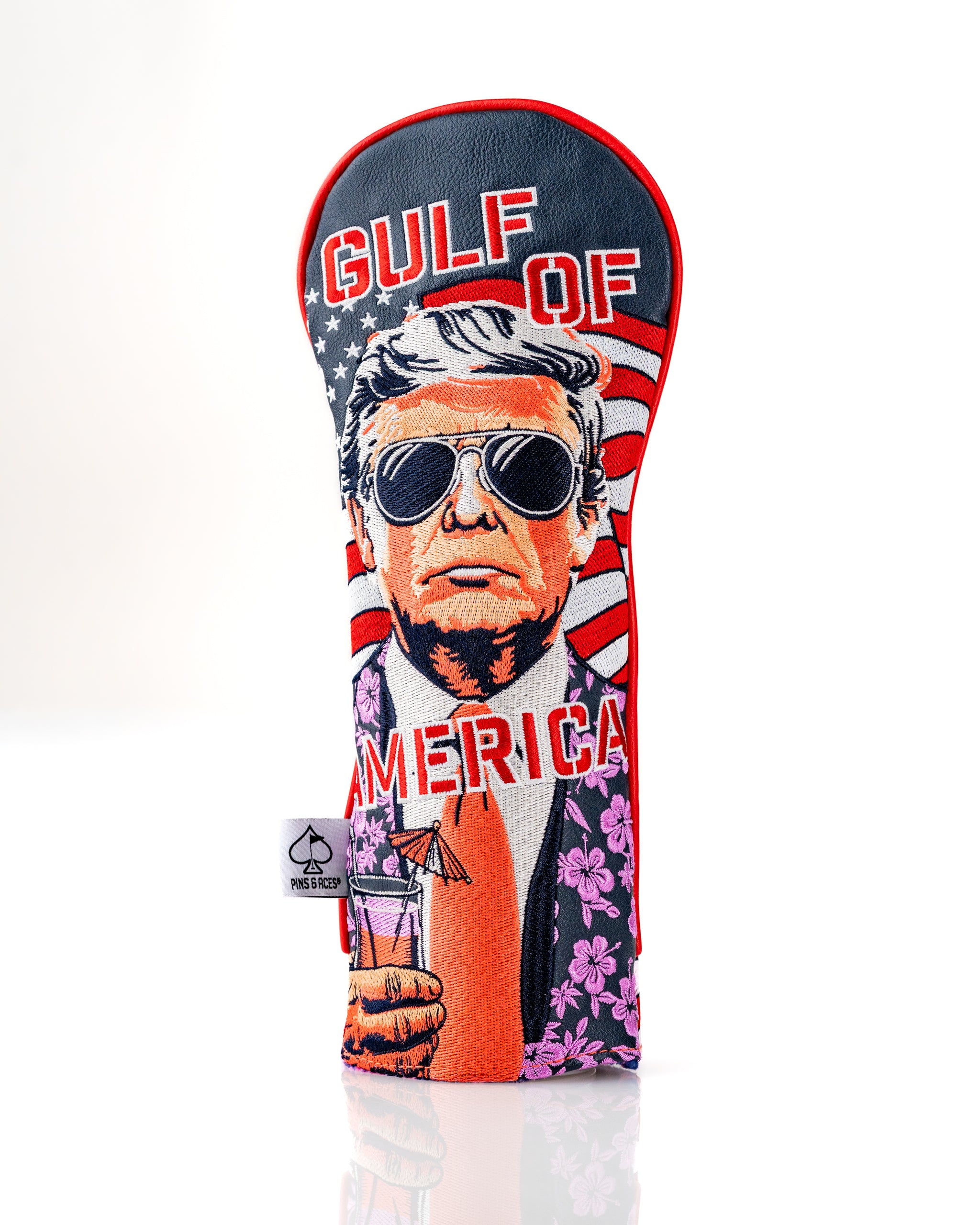 Bold fairway cover featuring a stylized illustration of a man in sunglasses, holding a drink, with "Gulf of America" text and patriotic colors.