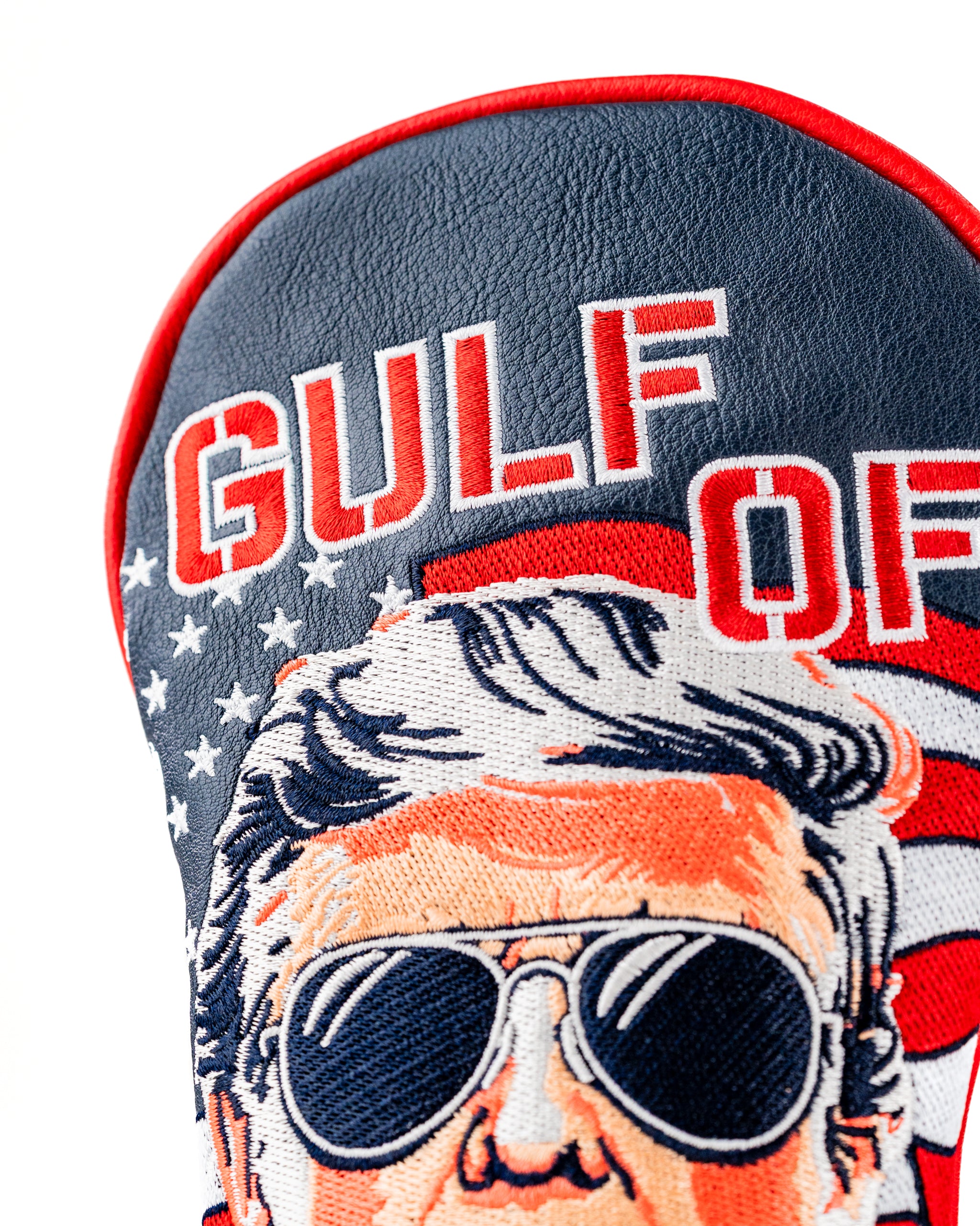 Bold golf fairway cover featuring a caricature of a man with sunglasses, patriotic colors, and "Gulf of America" text.