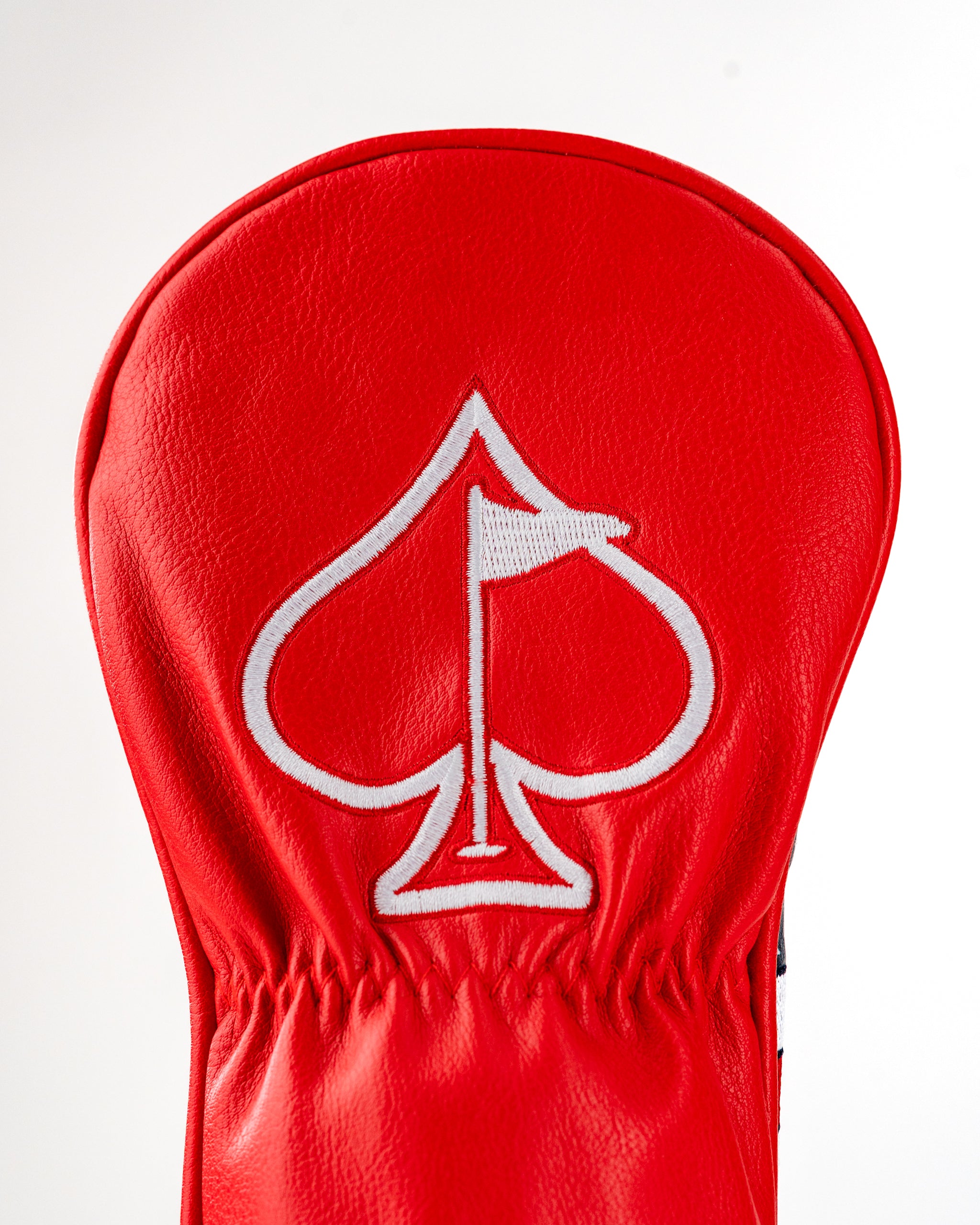 Bold red fairway cover featuring a white spade logo, designed for golfers who want to make a statement on the course.