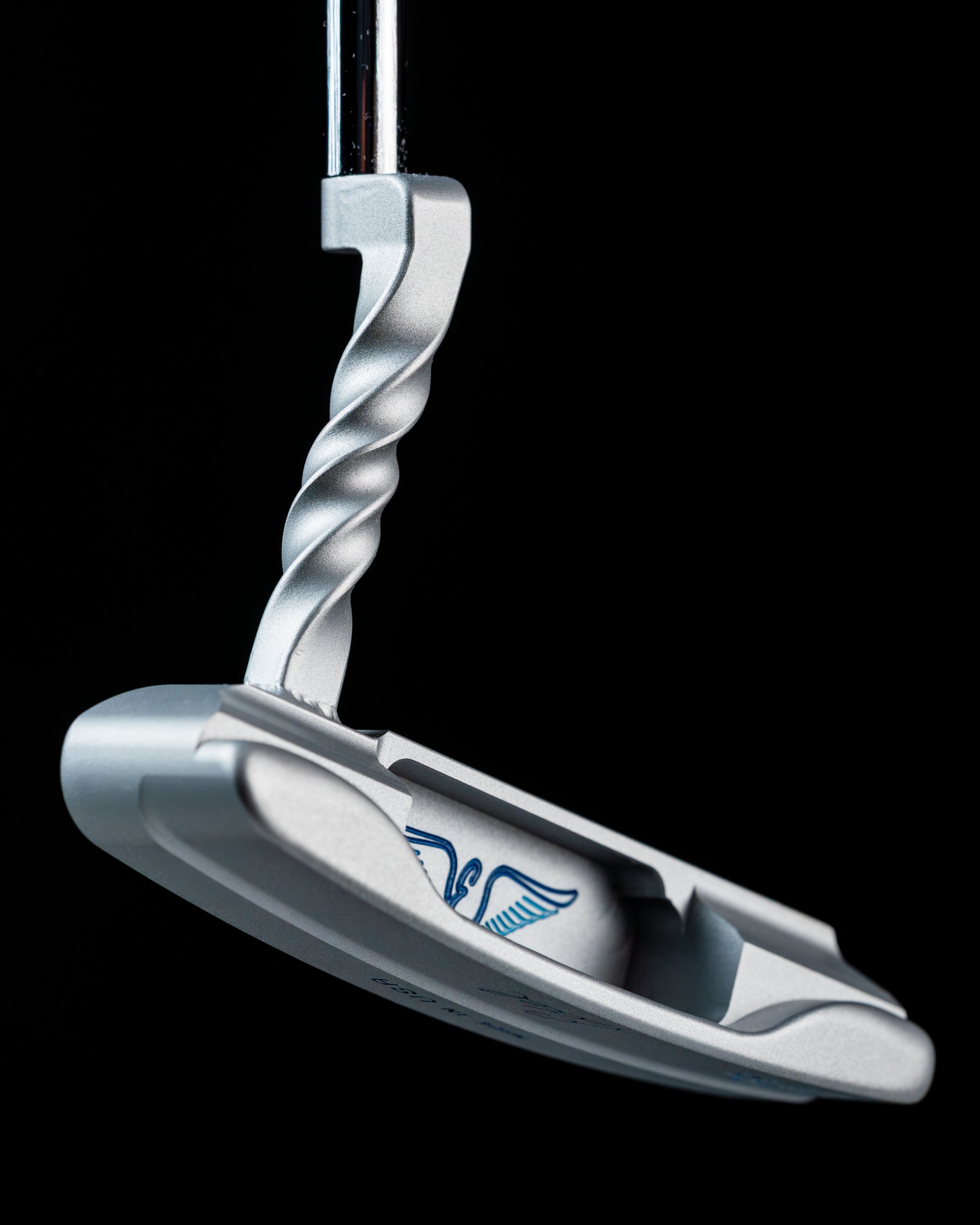 Edel Twister Putter features a unique twisted design with a sleek silver finish, ideal for precision putting on the golf course.