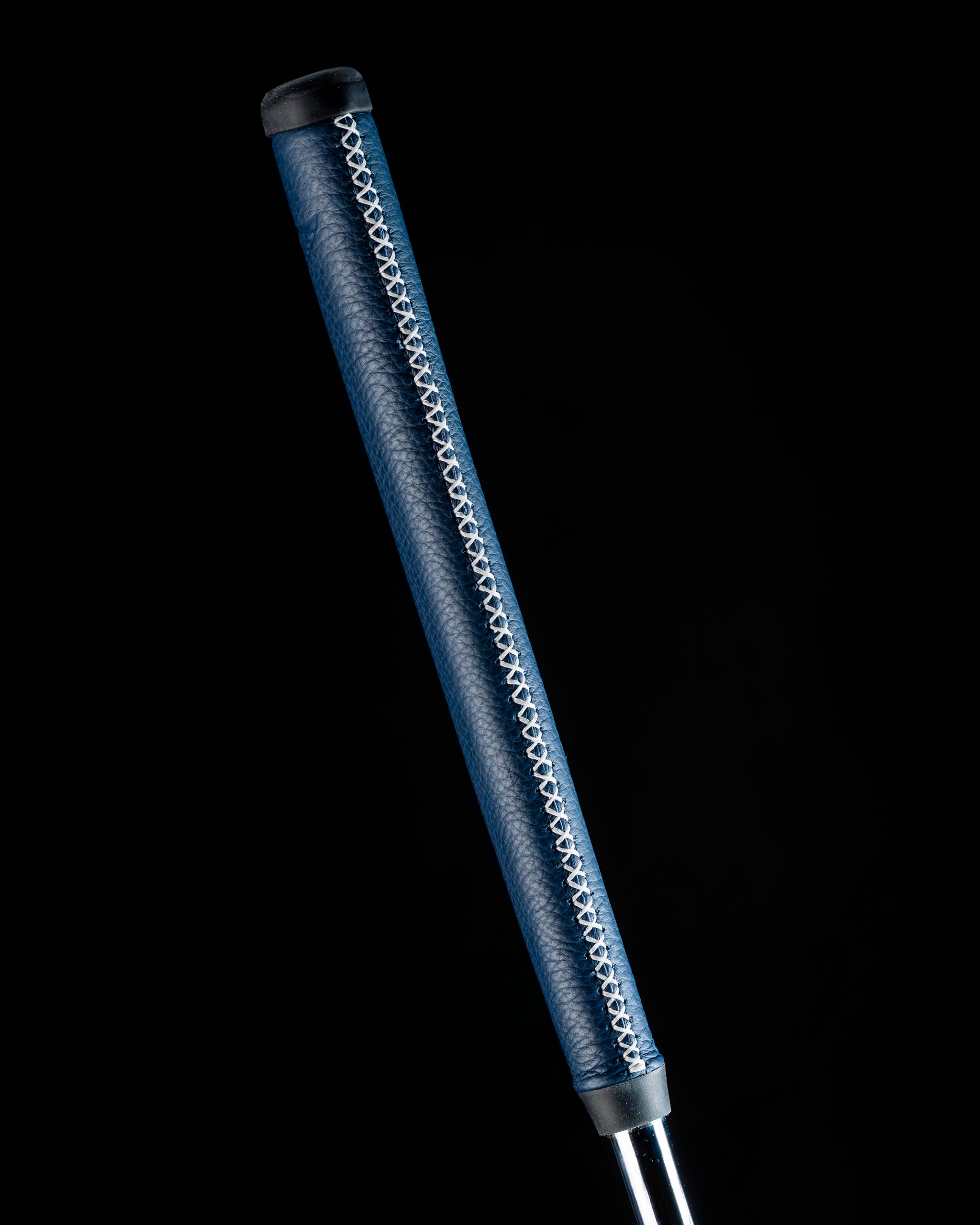 Edel Twister Putter featuring a sleek blue grip with intricate stitching, designed for precision and style on the golf course.