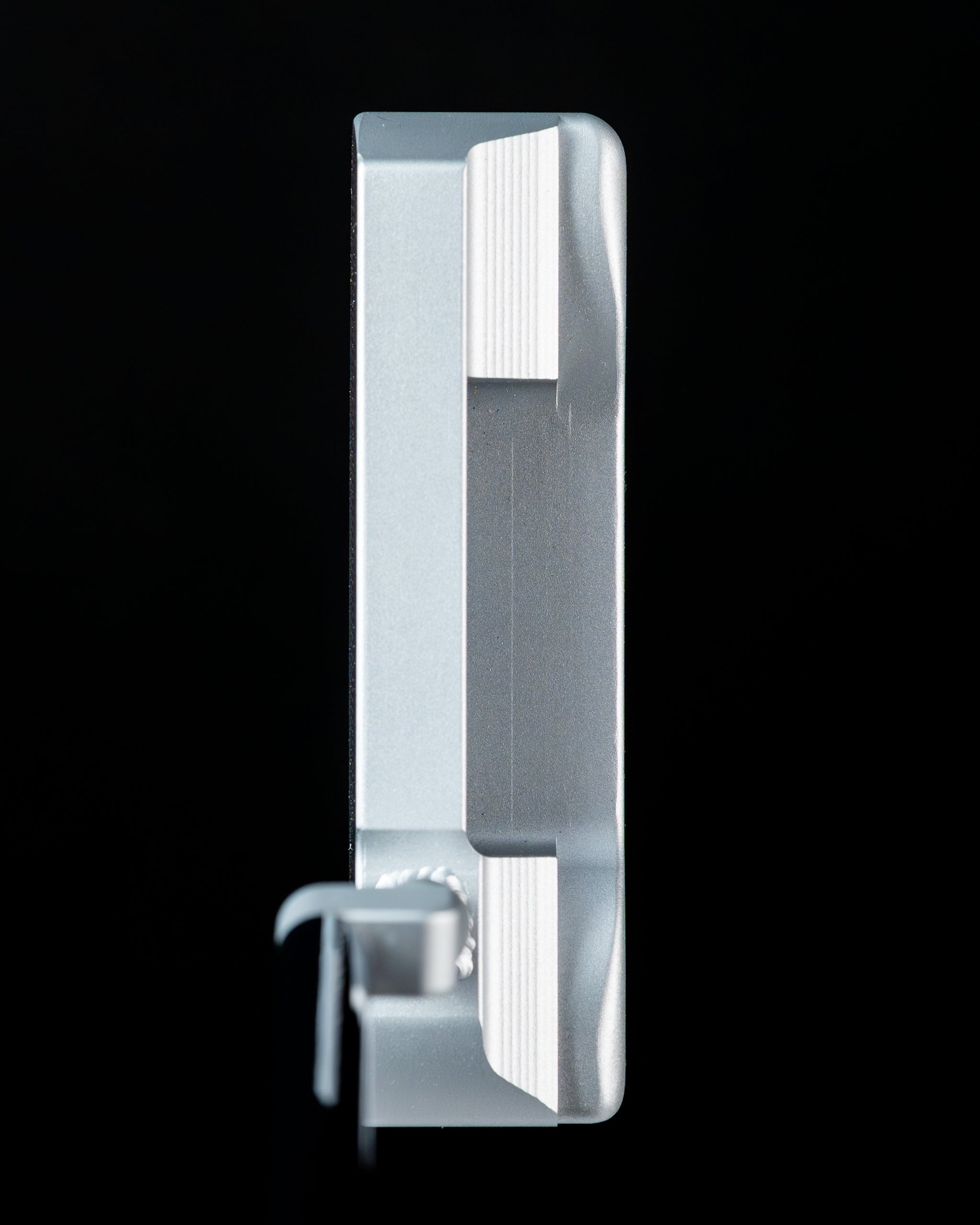 Sleek Edel Twister Putter showcasing a silver finish and unique design for precision putting on the golf course.