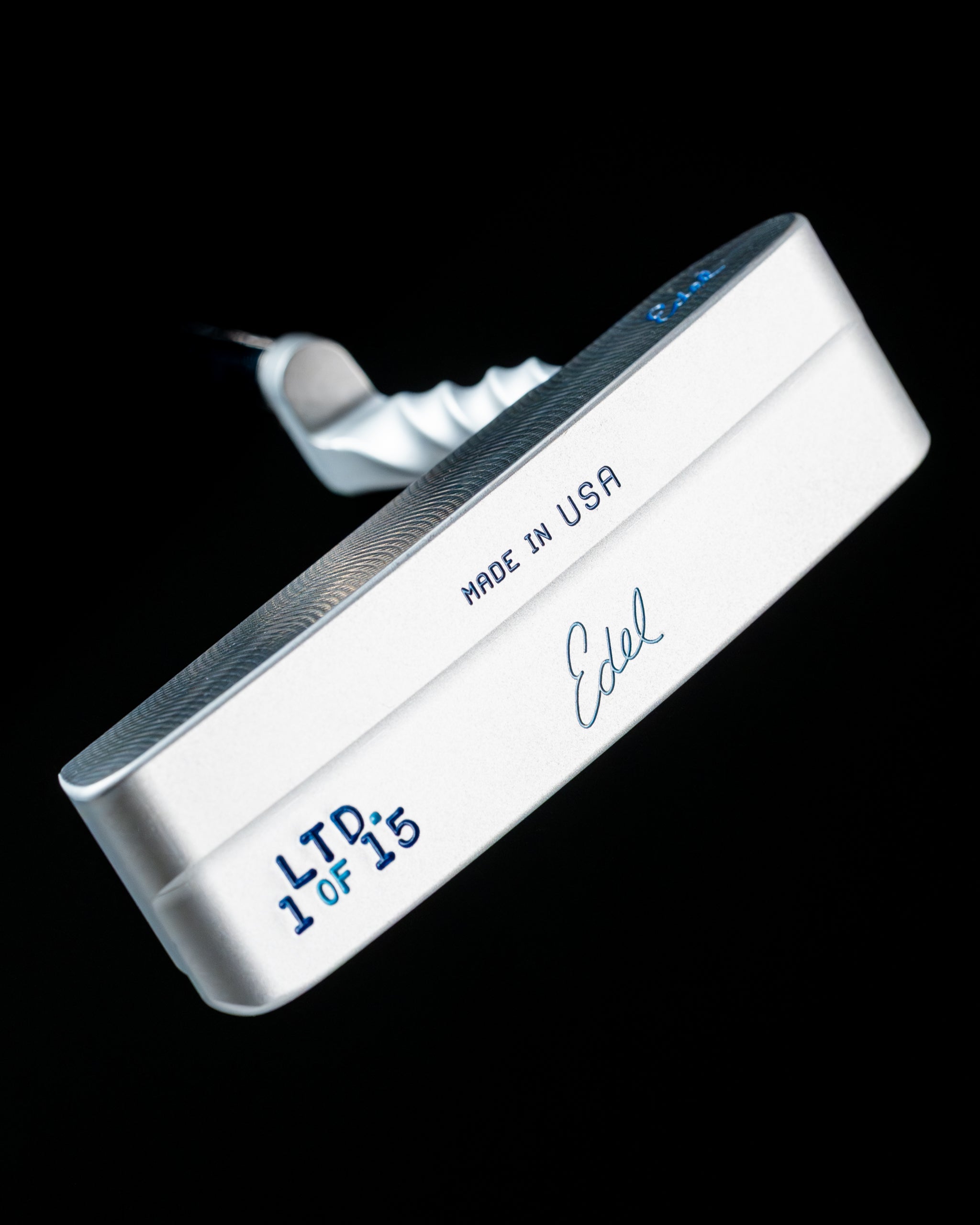 Limited edition Edel Twister putter showcasing a sleek silver design with a textured face and unique engraving.