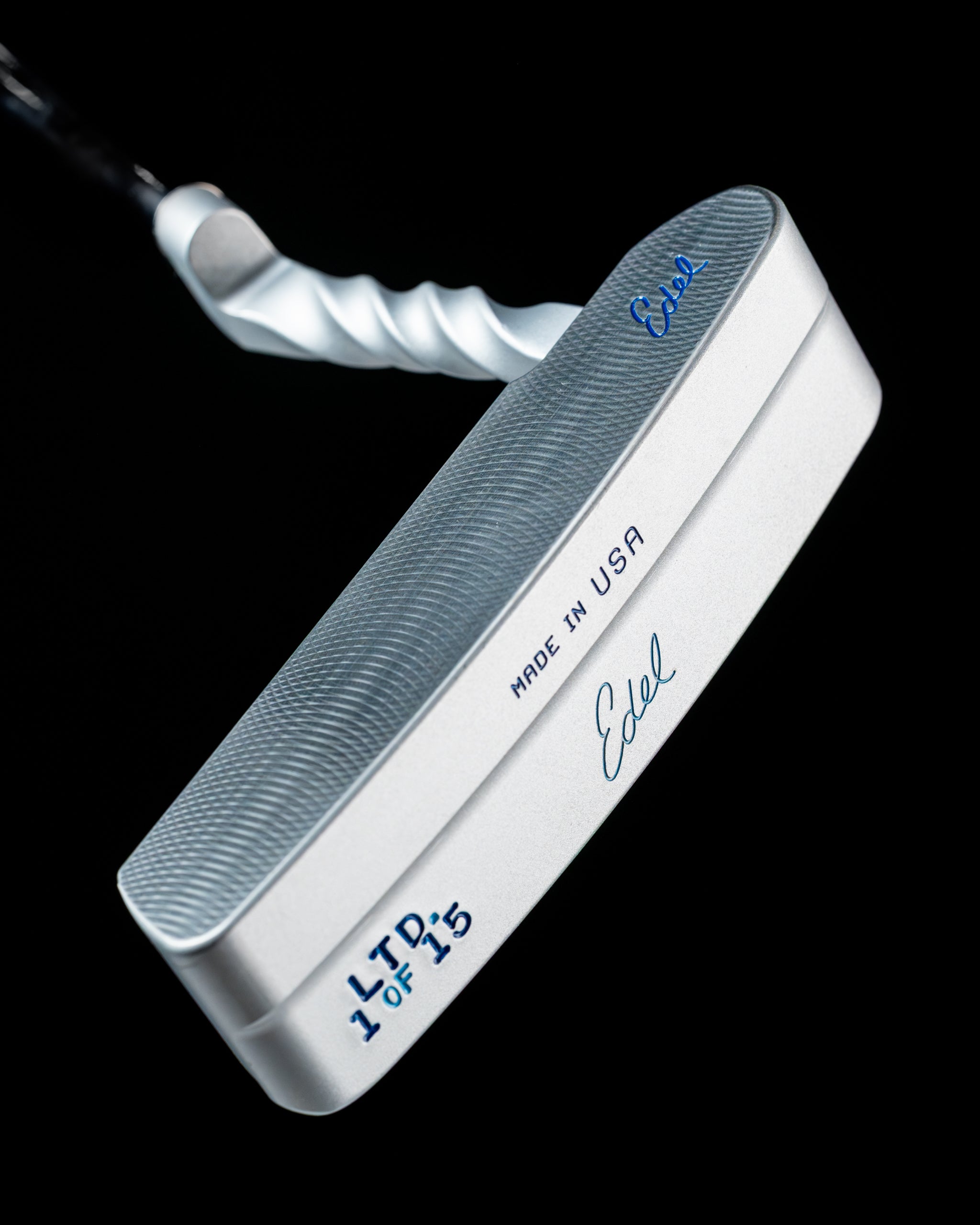 Edel Twister Putter featuring a sleek silver finish, textured face, and unique twisted shaft design, made in the USA.