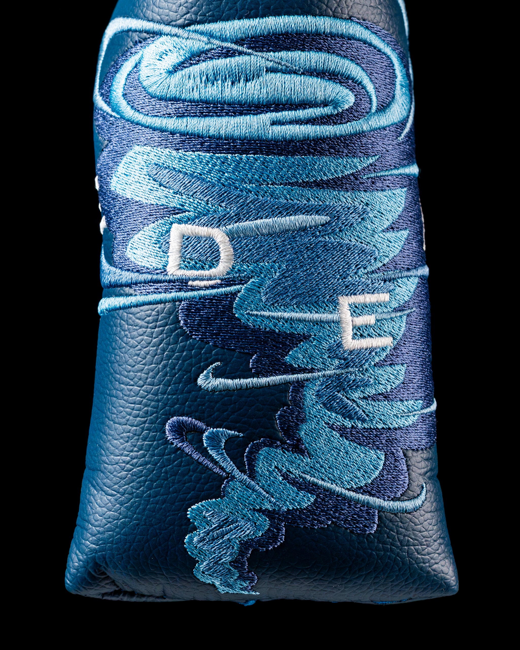 Edel Twister Putter headcover featuring a dynamic blue swirl design with embroidered initials, perfect for stylish golfers.