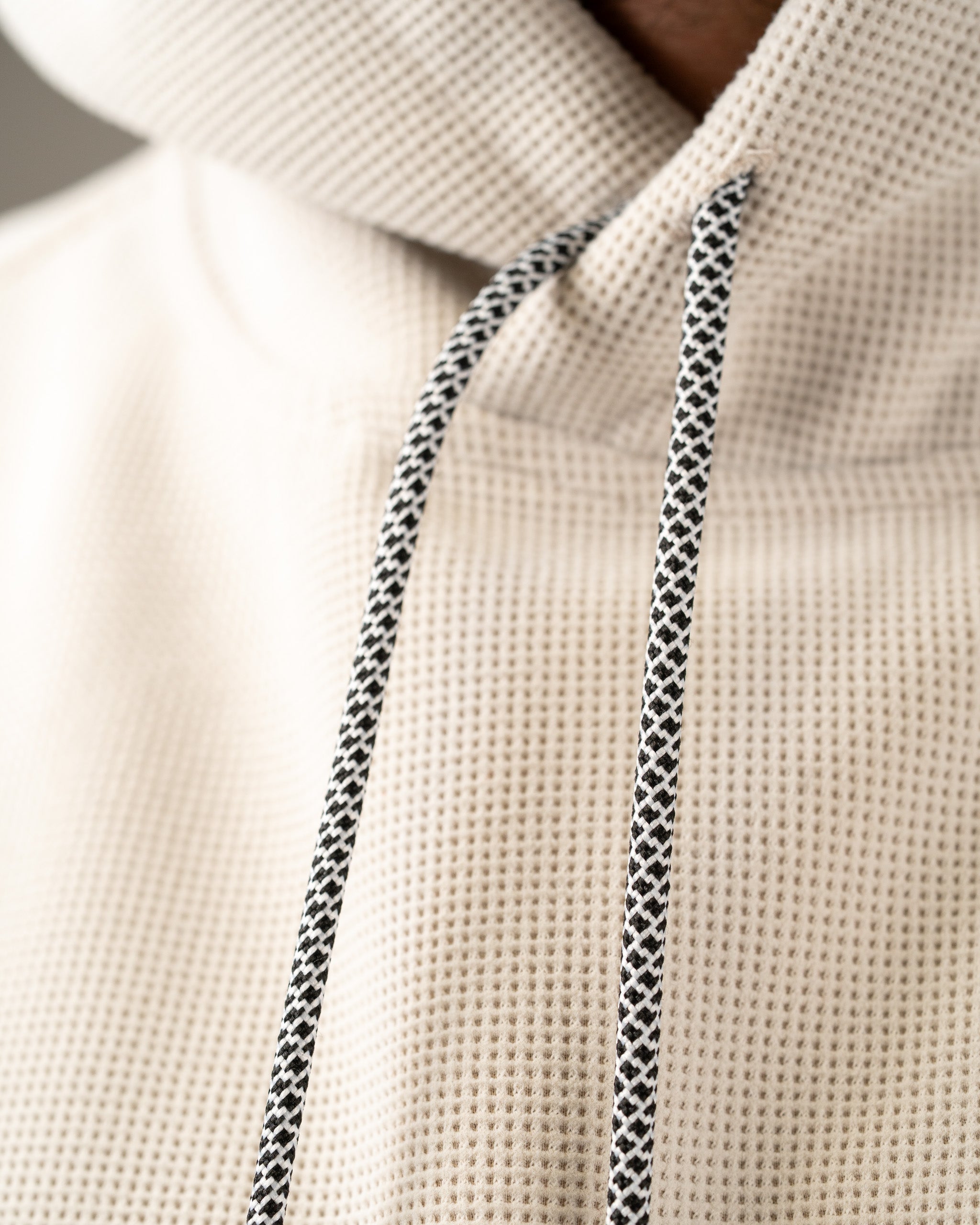 Player Preferred Waffle Grid Hoodie in Dark Stone features a textured fabric and contrasting drawstrings for a stylish look.