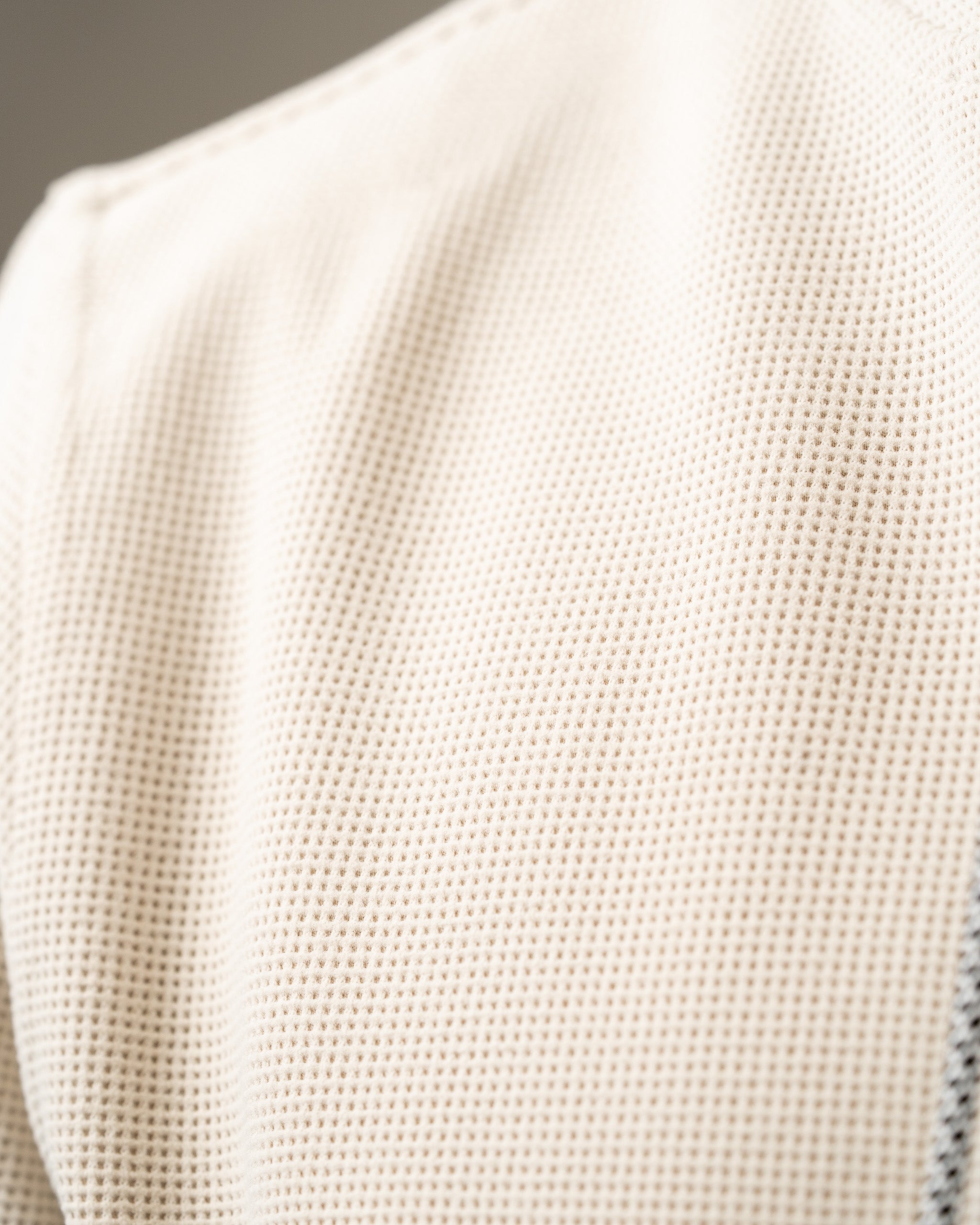 Close-up of the textured waffle grid fabric of the Player Preferred Waffle Grid Hoodie in Dark Stone color.