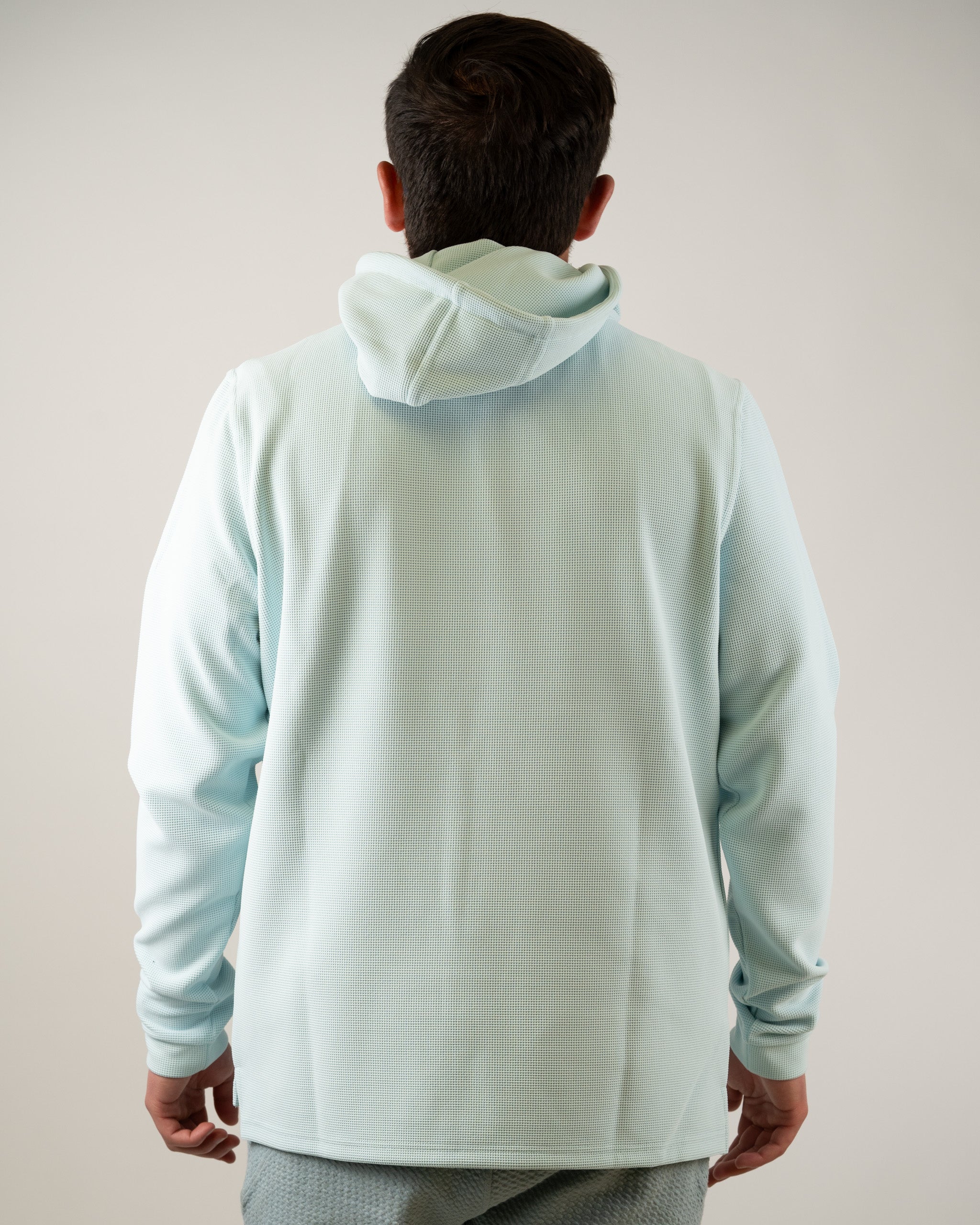 Men's Ice Blue Player Preferred Waffle Grid Hoodie featuring a relaxed fit and cozy hood, perfect for stylish golf outings.